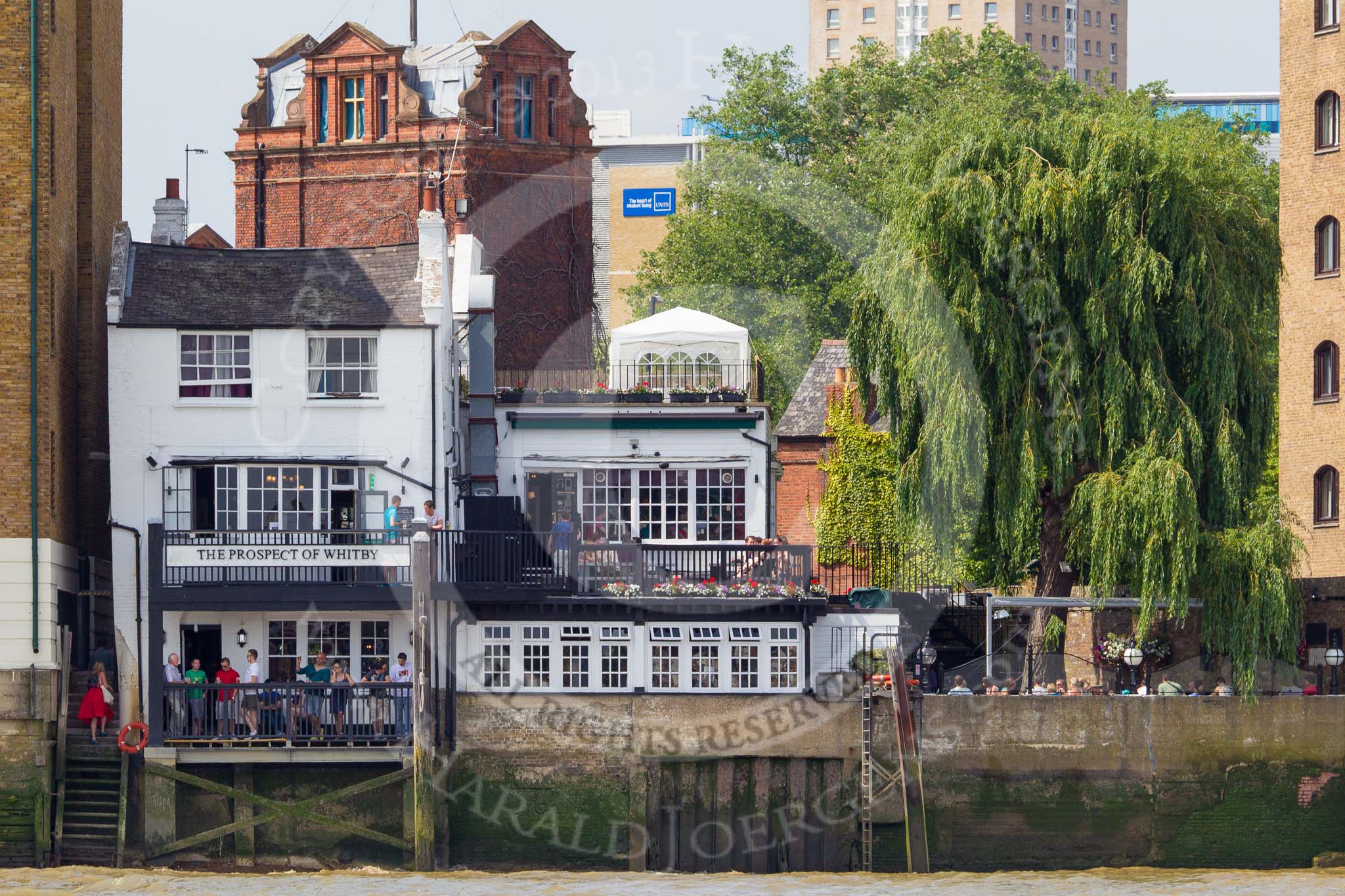 TOW River Thames Barge Driving Race 2013: Said to be the oldest riverside tavern: The Prospect of Whitby public house at Wapping Wall, London E1W, seen from the river..
River Thames between Greenwich and Westminster,
London,

United Kingdom,
on 13 July 2013 at 15:08, image #549