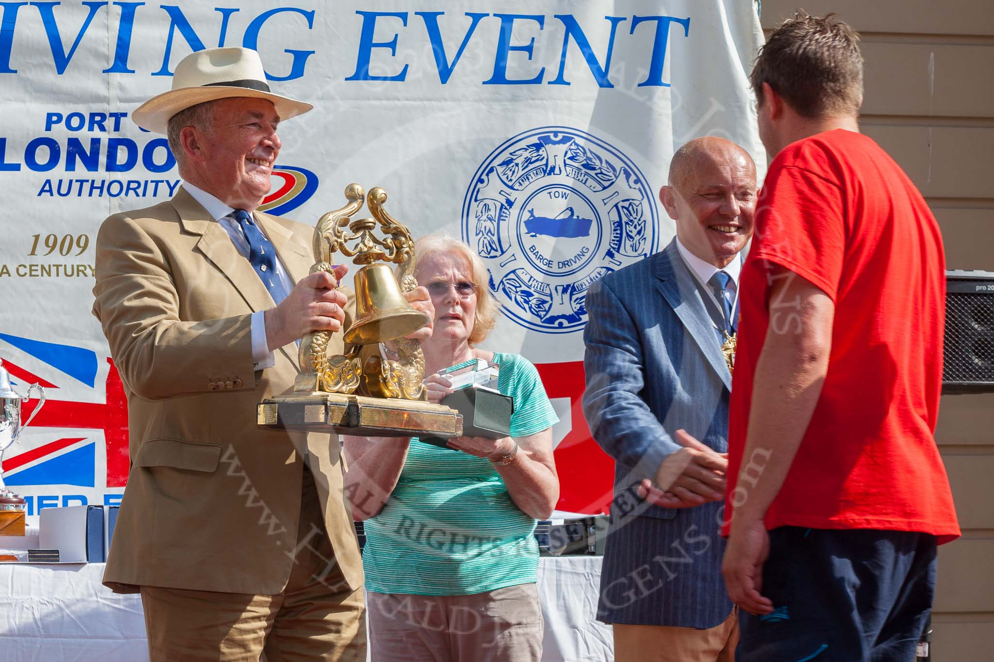 TOW River Thames Barge Driving Race 2013: Admiral Alan West handing over the Transport on Water Challenge Trophy, for the first overall winner, to the crew of barge "Blackwall", by the Port of London Authority..
River Thames between Greenwich and Westminster,
London,

United Kingdom,
on 13 July 2013 at 16:28, image #581