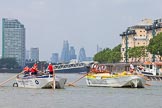 Photo 1307131241175D23789HaraldJoergens TOW River Thames Barge Driving Race 2013: Barge "Hoppy", by GPS Fabrication, approaching Masthouse Terrace Pier. On the left barge "Spirit of Mountabatten", by Mechanical Movements and Enabling Services Ltd. In the background the skyscrapers of the City of London..
River Thames between Greenwich and Westminster,
London,
United Kingdom,
on 13 July 2013 at 12:41, image #169