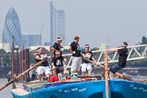 Photo 1307131242005D23830HaraldJoergens TOW River Thames Barge Driving Race 2013: Rowers on the deck of of barge "Darren Lacey", by Princess Pocahontas, during the race. In the background the skyscrapers of the City of London, including the "Gherkin"..
River Thames between Greenwich and Westminster,
London,
United Kingdom,
on 13 July 2013 at 12:42, image #179