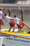 TOW River Thames Barge Driving Race 2013: Rowers wearing skirts on the deck of of barge "Hoppy" by GPS Fabrication..
River Thames between Greenwich and Westminster,
London,

United Kingdom,
on 13 July 2013 at 12:44, image #192