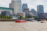 TOW River Thames Barge Driving Race 2013: Barge "Jane", by the RMT Union, followed by barge"Shell Bay" by South Dock Marina,  in front of the skyscrapers at Canary Wharf..
River Thames between Greenwich and Westminster,
London,

United Kingdom,
on 13 July 2013 at 13:16, image #304