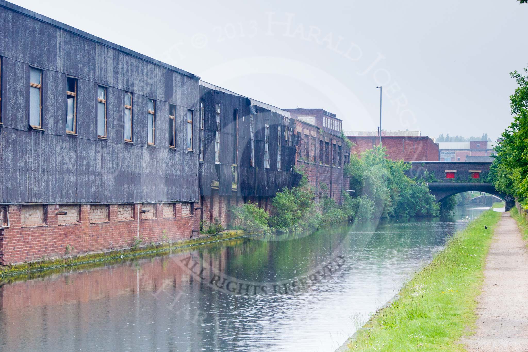 BCN Marathon Challenge 2014: Bridge 106 (Duddeston Mill Road Bridge) at Garrison Locks on the Grand Union Canal (Birmingham & Warwick Junction Canal), with old industry in a rather sad state on the left - but work seemed to be going on inside.
Birmingham Canal Navigation,


United Kingdom,
on 24 May 2014 at 08:35, image #76