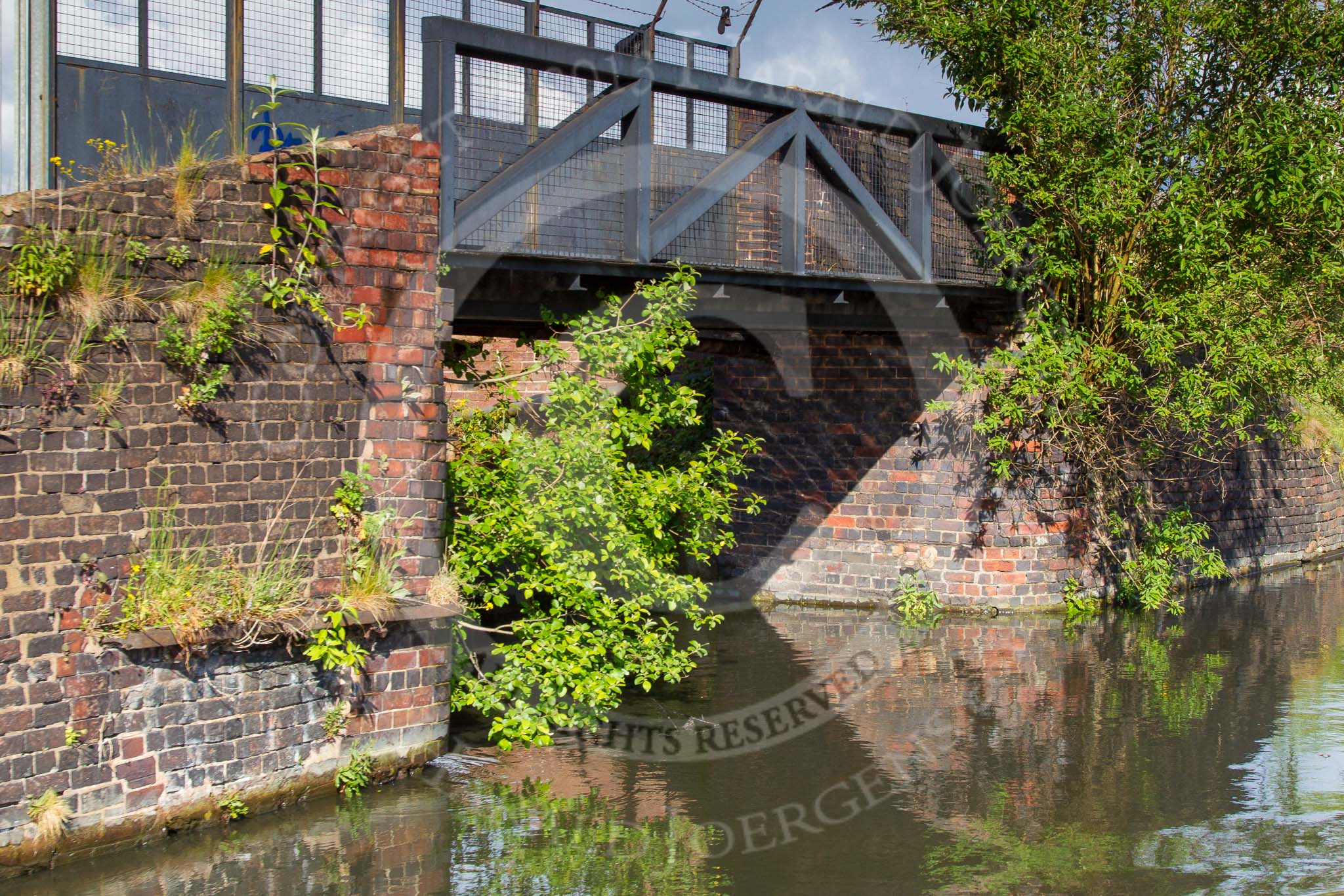 BCN Marathon Challenge 2014: Old factory bridge on the New Main Line close to Pudding Green Junction, the arm could have served Blue Brick Works.
Birmingham Canal Navigation,


United Kingdom,
on 24 May 2014 at 17:31, image #167