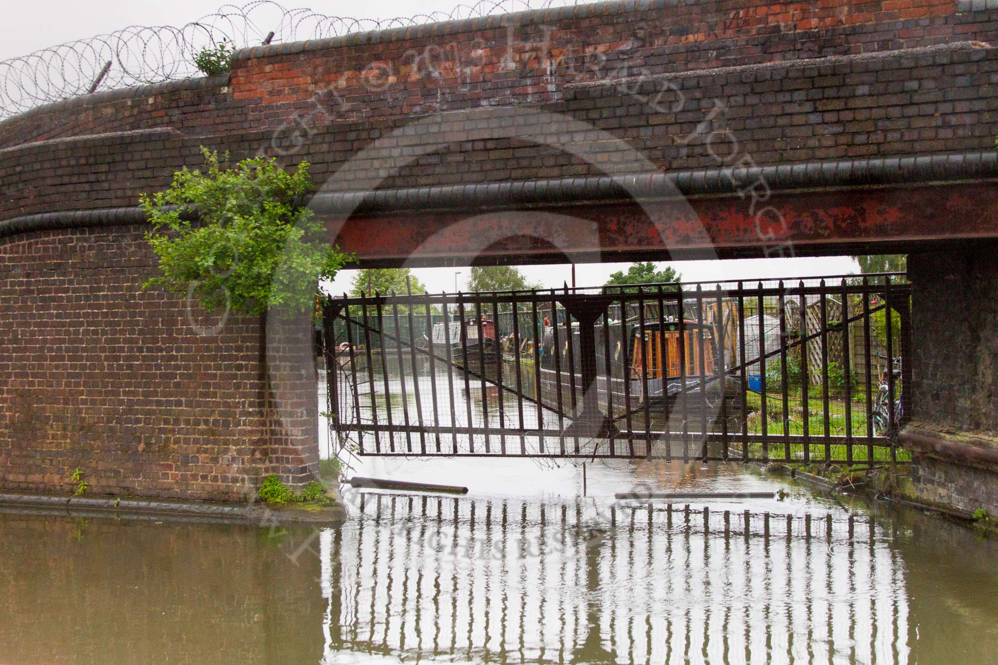 BCN Marathon Challenge 2014: Bridge on the Dudley No 1 Canal leading to a Shropshire Union basin with an old warehouse and stables carrying an LMS advertisment.
Birmingham Canal Navigation,


United Kingdom,
on 25 May 2014 at 06:55, image #213