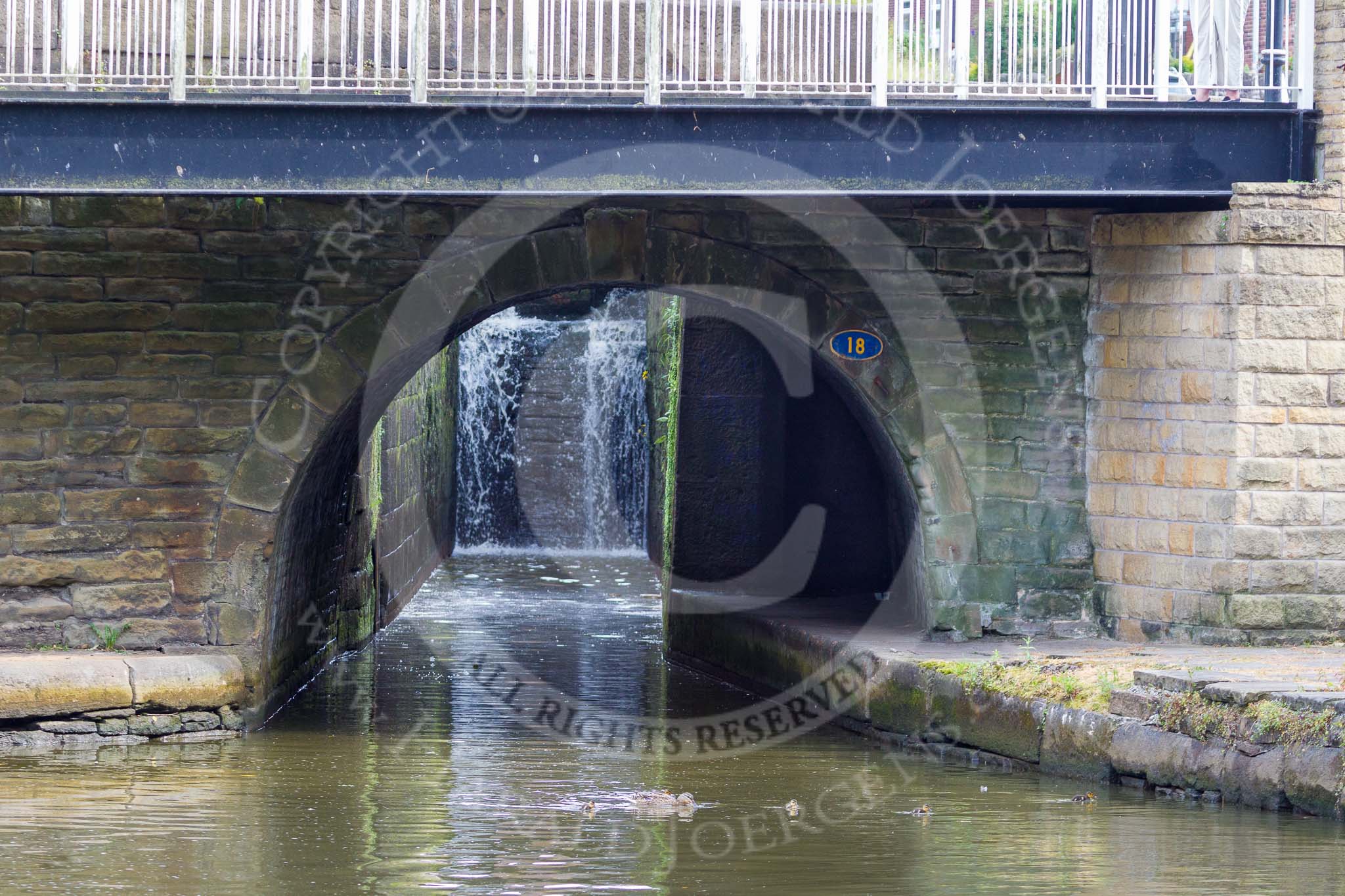 : Marple lock 13: There is a small tunnel, just below the "18" (which refers to the bridge), for boatmen to leave the boat when entering the lock..




on 03 July 2015 at 17:40, image #81