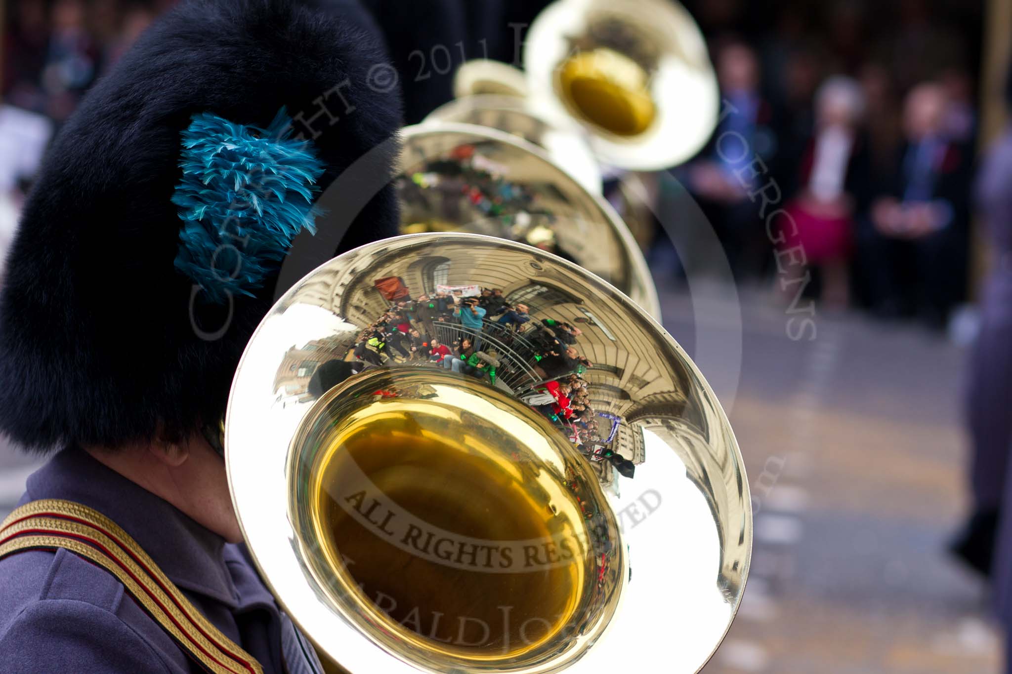The Lord Mayor's Show 2011: The Band of the Irish and Welsh Guards, here looking into a tuba to see spectators and press photographers..
Opposite Mansion House, City of London,
London,
-,
United Kingdom,
on 12 November 2011 at 11:04, image #75
