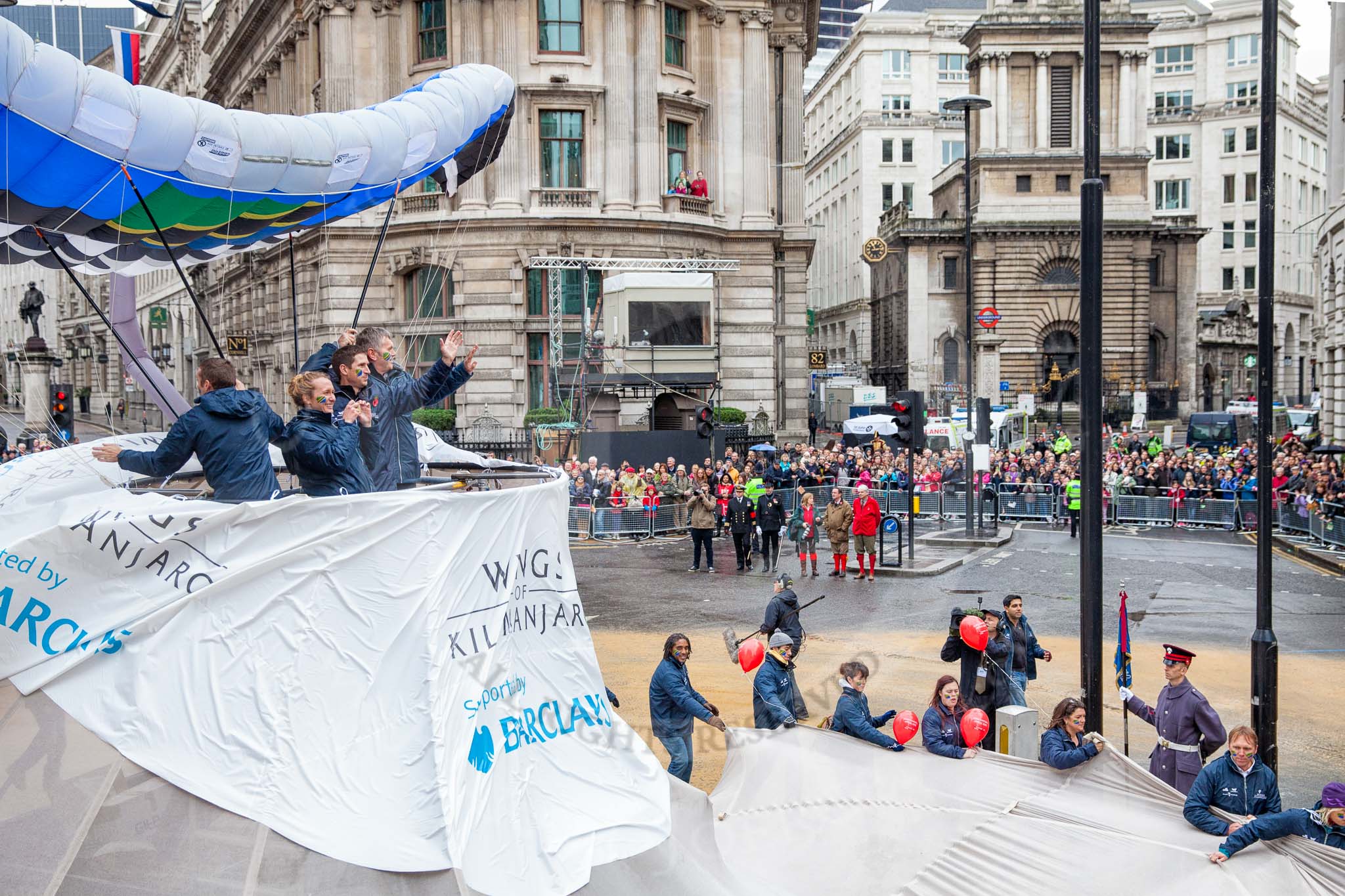 Lord Mayor's Show 2012: Entry 22 - Wings of Kilimanjaro - paraglider pi;ots about to fly from Mt Kilimanjaro for charity..
Press stand opposite Mansion House, City of London,
London,
Greater London,
United Kingdom,
on 10 November 2012 at 11:10, image #384