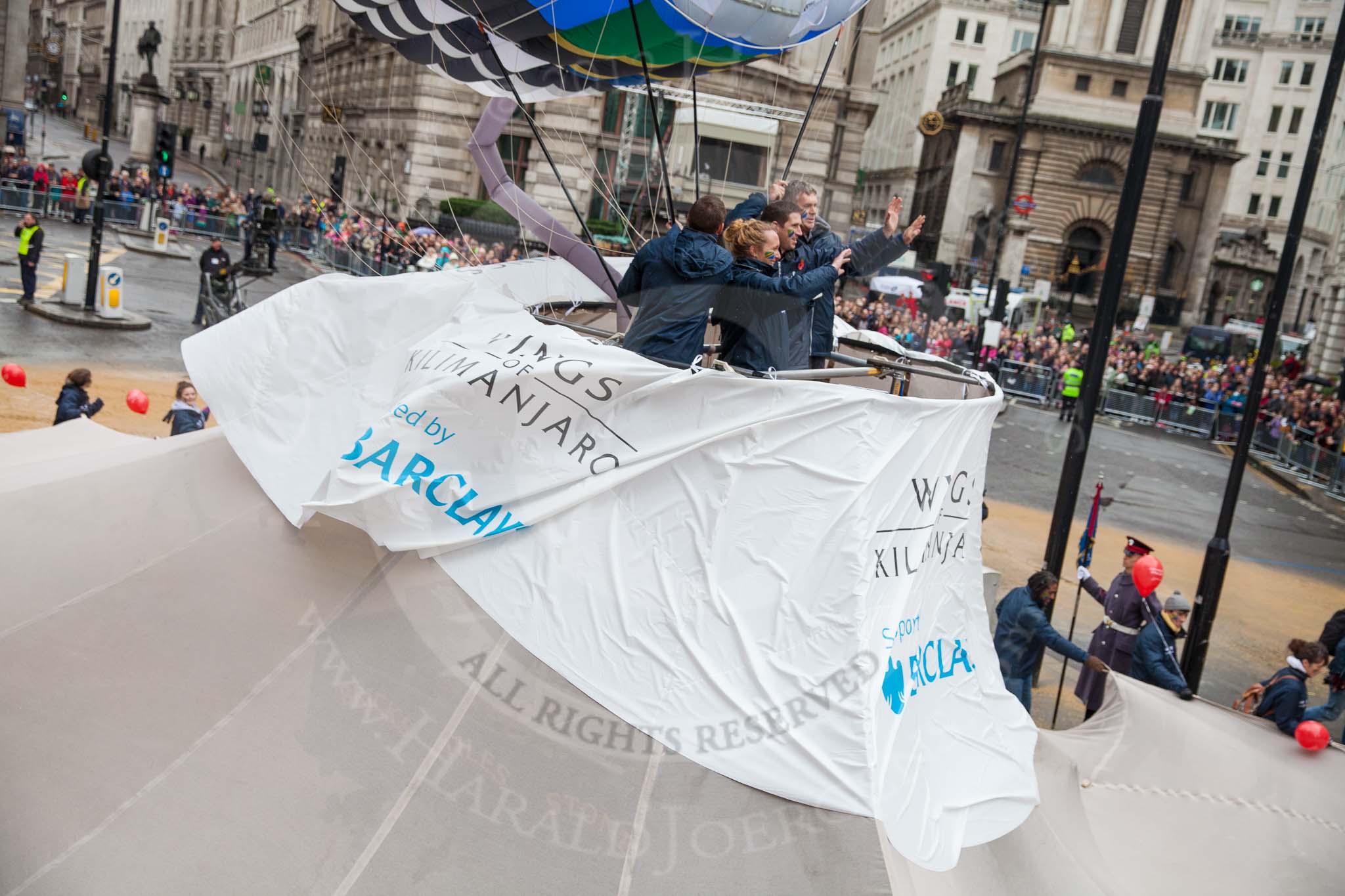 Lord Mayor's Show 2012: Entry 22 - Wings of Kilimanjaro - paraglider pi;ots about to fly from Mt Kilimanjaro for charity..
Press stand opposite Mansion House, City of London,
London,
Greater London,
United Kingdom,
on 10 November 2012 at 11:10, image #385