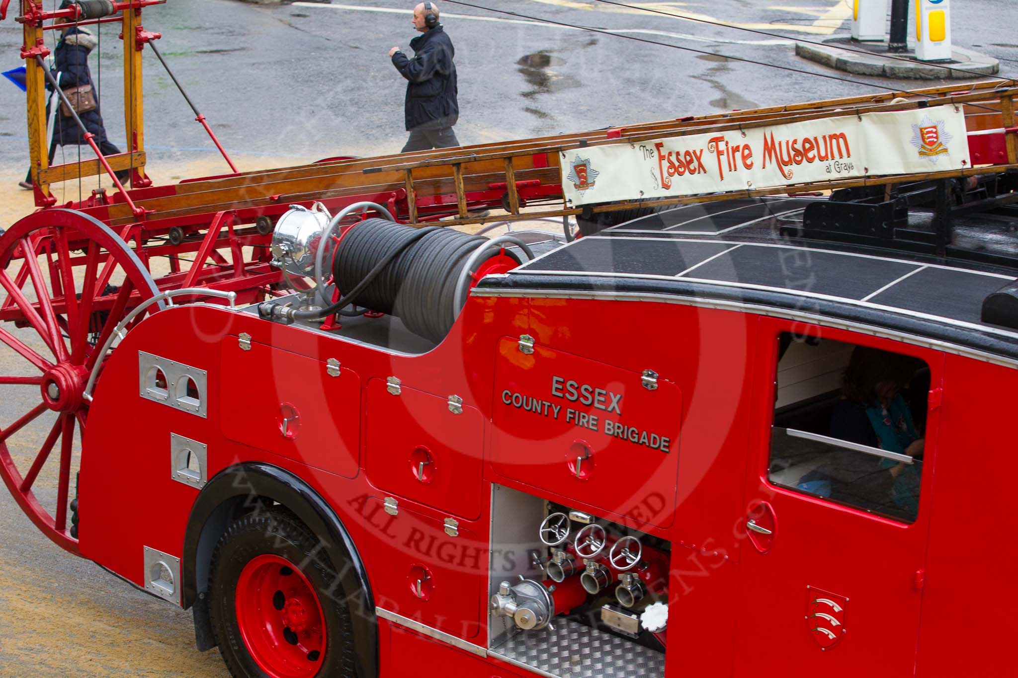 Lord Mayor's Show 2012: Entrry 104 - Modern Livery Companies, representing 26 Livery Companies, here with a historic Dennis fire engine..
Press stand opposite Mansion House, City of London,
London,
Greater London,
United Kingdom,
on 10 November 2012 at 11:52, image #1463