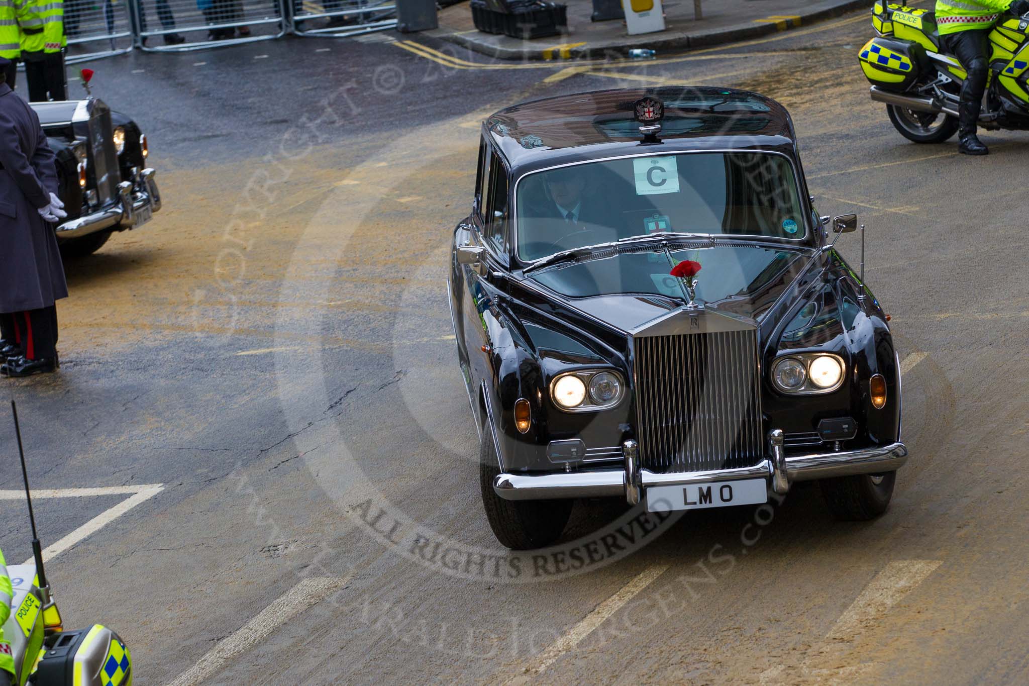 Lord Mayor's Show 2012: The Rolls Royce, registration LMO, leaving with a police escort..
Press stand opposite Mansion House, City of London,
London,
Greater London,
United Kingdom,
on 10 November 2012 at 12:15, image #1960
