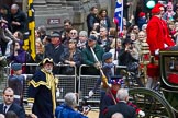 Lord Mayor's Show 2012: Entry 142 - Late Lord Mayor, Alderman and Mrs David Wootton, with the Chaplain Andrew Walker, escorted by four Yeoman Warders and cadets of 1475 (Dulwich) Squadron. Two Dogget's Coat and Badge men stand on the rear of the carriage..
Press stand opposite Mansion House, City of London,
London,
Greater London,
United Kingdom,
on 10 November 2012 at 12:08, image #1909