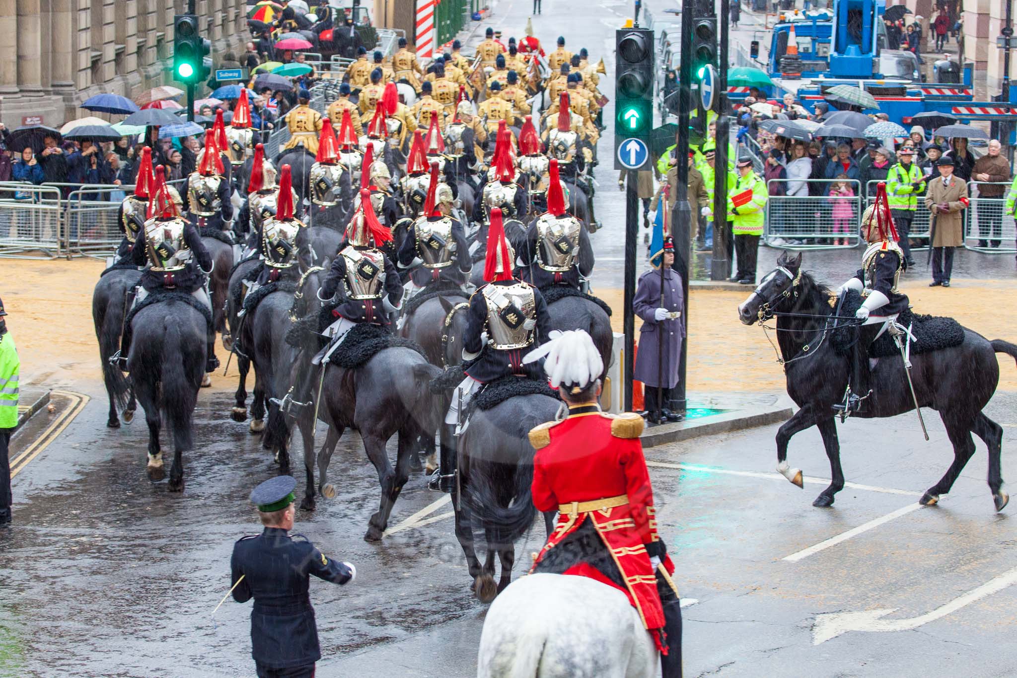 Lord Mayor's Show 2013: The Mounted Band of the Household Cavalry and the Blues and Royals riding down Queen Victoria Street. They will be seen again when the Lord Mayor leaves Mansion House for St Paul..
Press stand opposite Mansion House, City of London,
London,
Greater London,
United Kingdom,
on 09 November 2013 at 10:49, image #98