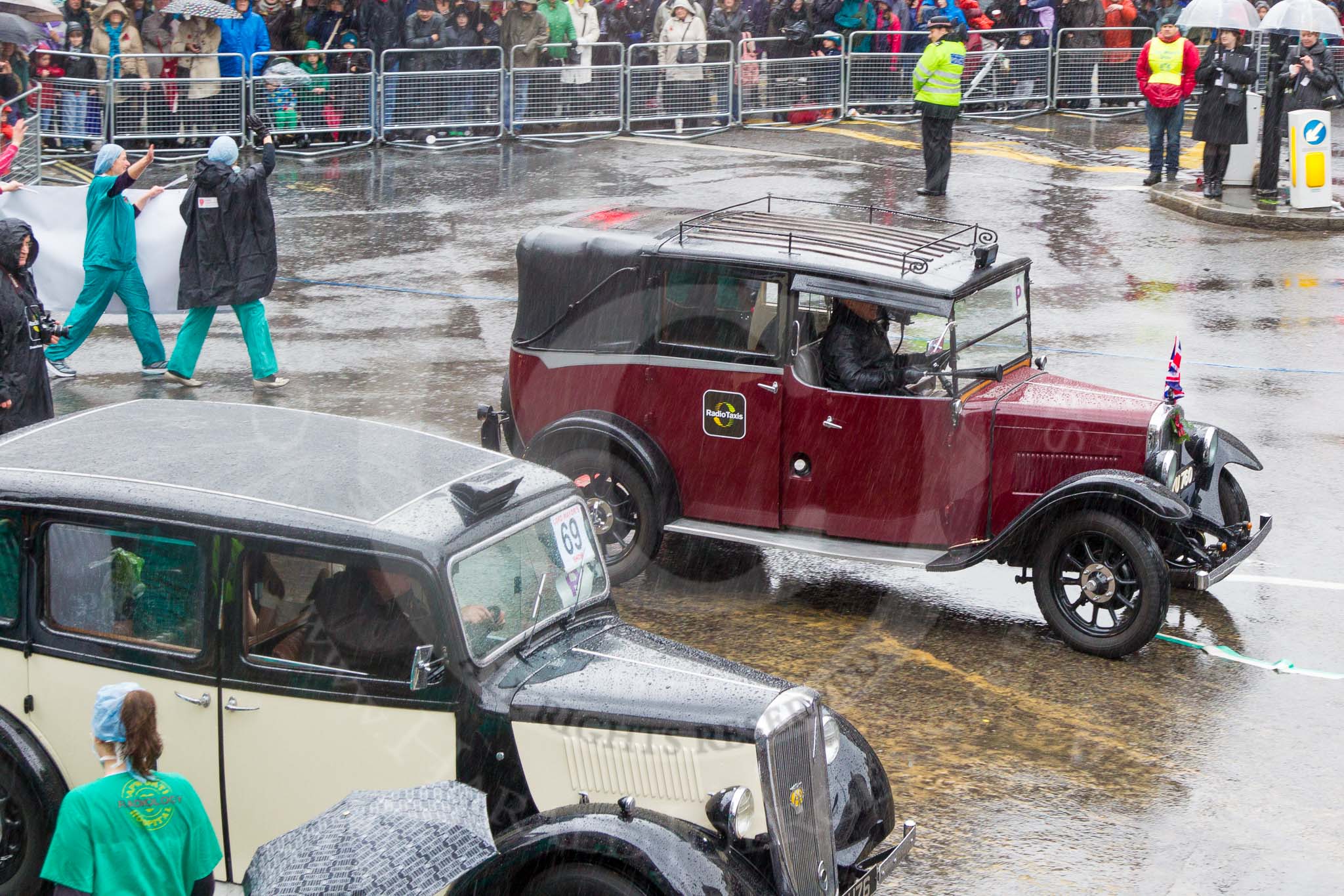 Lord Mayor's Show 2013: 69-Radio Taxis Group-today's entry celebrates 60 years of taxi history and supports the Papworth Heart Hospital..
Press stand opposite Mansion House, City of London,
London,
Greater London,
United Kingdom,
on 09 November 2013 at 11:37, image #836