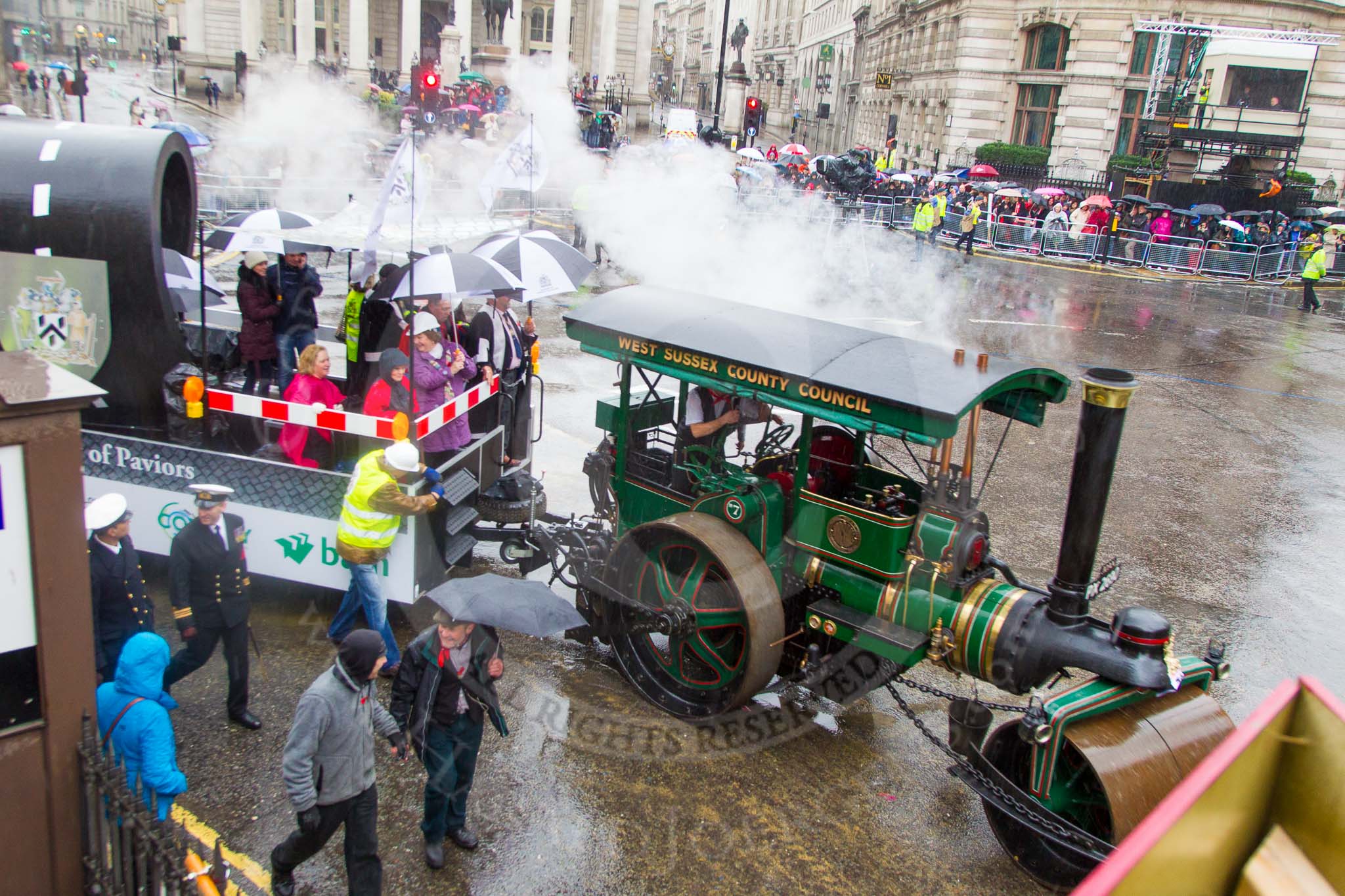 Lord Mayor's Show 2013: 70-Worshipful Company of Paviors-which brings together construction-industry professionals involved with roads and pavements.This year's float features the 'pig' that mediaeval paviors would have cleared from city streets and it towed by a steamroller from Amberley museum..
Press stand opposite Mansion House, City of London,
London,
Greater London,
United Kingdom,
on 09 November 2013 at 11:39, image #849