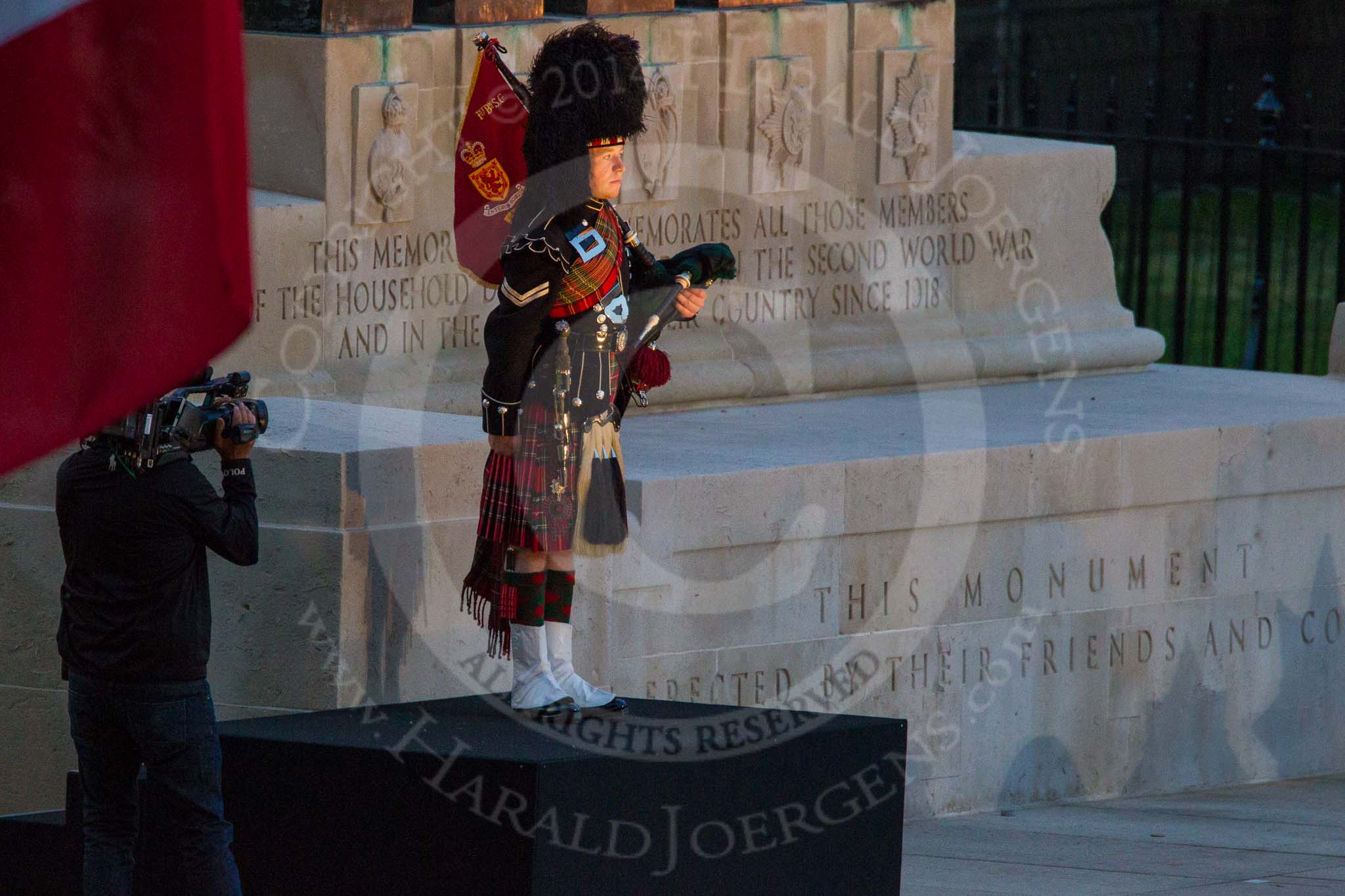 Beating Retreat 2014: The lone piper, playing "Lord Lovetts Lament" at the Guards Memorial - Lance Corporal James Bell, 1st Battalion Scots Guards, F Company Scots Guards' piper..
Horse Guards Parade, Westminster,
London SW1A,

United Kingdom,
on 11 June 2014 at 21:11, image #288