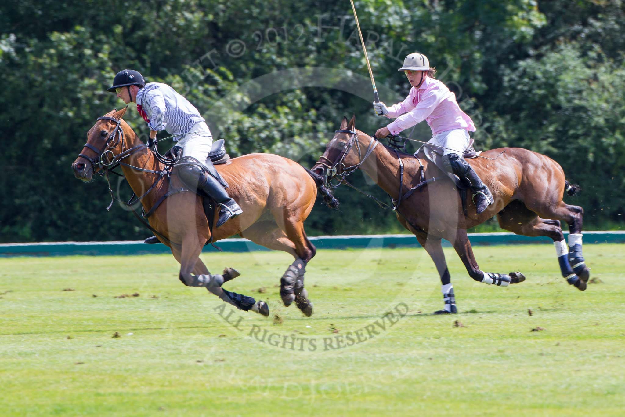 7th Heritage Polo Cup semi-finals: John Martin, Team Silver Fox USA, playing to goal, followed by Nico Talamoni, Team Emerging Switzerland..
Hurtwood Park Polo Club,
Ewhurst Green,
Surrey,
United Kingdom,
on 04 August 2012 at 11:37, image #67
