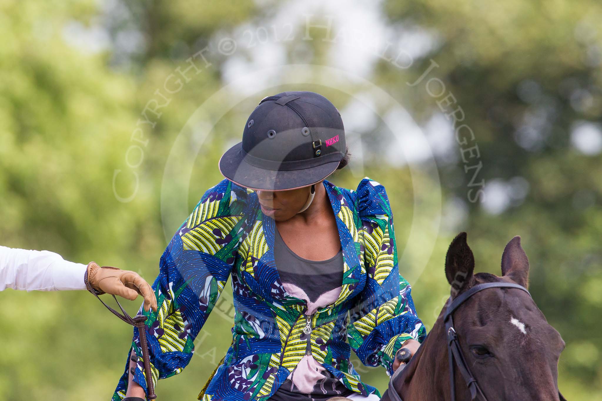 7th Heritage Polo Cup semi-finals: Uneku Atawodi Team Captain of the AMG PETROENERGY Polo Team wearing Fashion of Nigerian Fashion Designer DNZY..
Hurtwood Park Polo Club,
Ewhurst Green,
Surrey,
United Kingdom,
on 04 August 2012 at 13:45, image #168