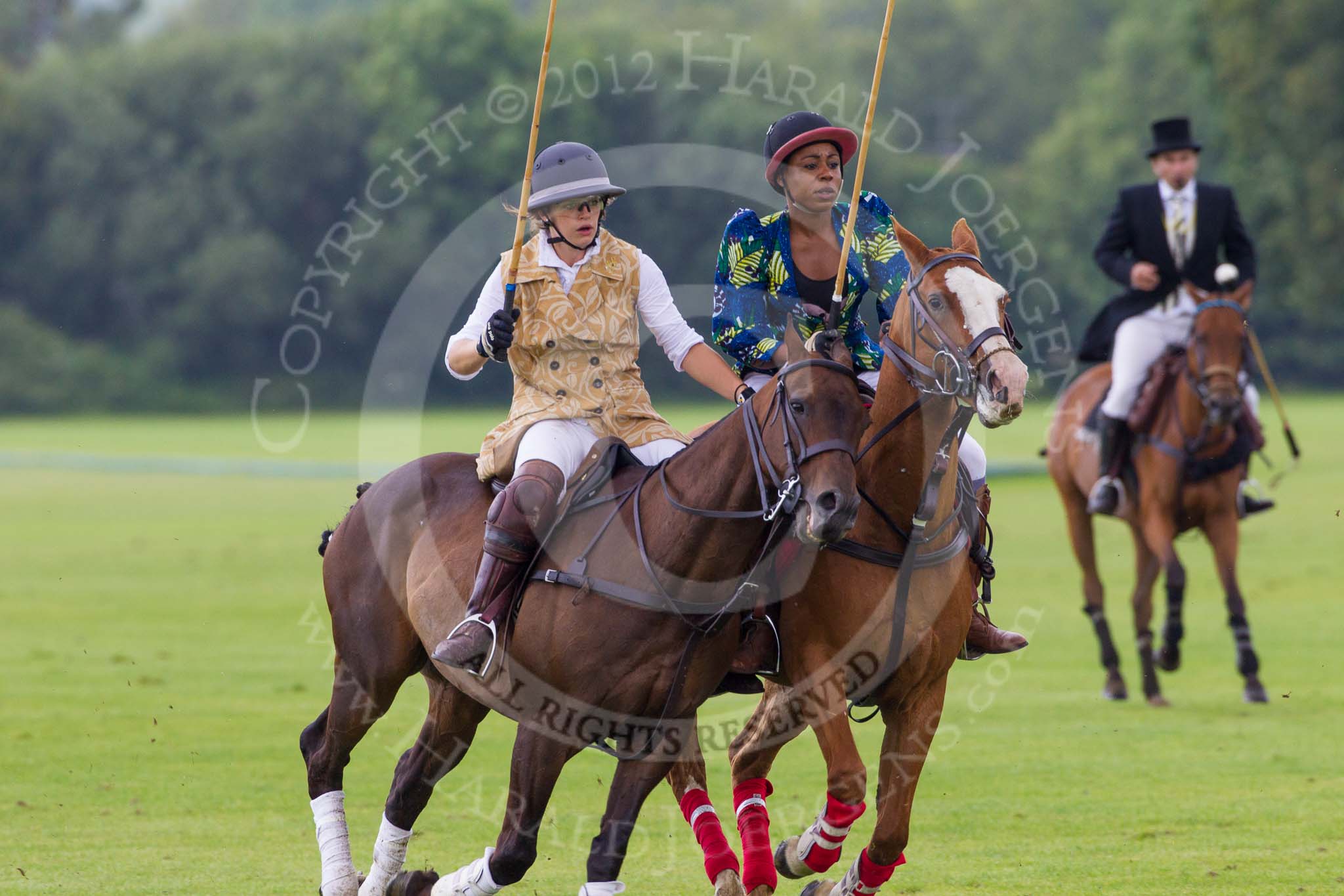 7th Heritage Polo Cup semi-finals: Emma Boers of the Amazons of Polo taking the man...Uneku Atawodi from Nigeria..
Hurtwood Park Polo Club,
Ewhurst Green,
Surrey,
United Kingdom,
on 04 August 2012 at 14:10, image #202