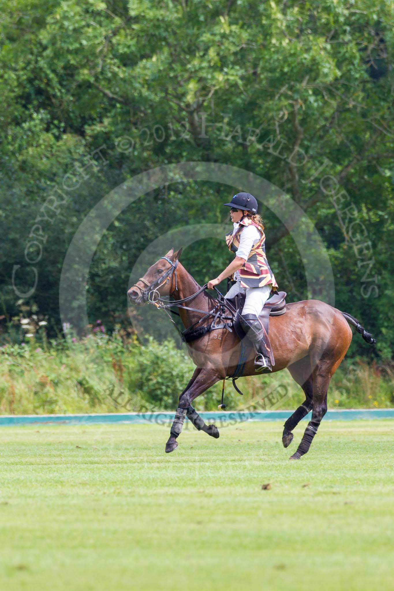 7th Heritage Polo Cup semi-finals: Rosie Ross..
Hurtwood Park Polo Club,
Ewhurst Green,
Surrey,
United Kingdom,
on 04 August 2012 at 14:43, image #223