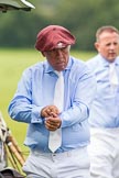 7th Heritage Polo Cup semi-finals: La Mariposa Argentina Mariano Darritchon putting on his T.M.Lewin Luxury Twill Shirt and cufflinks..
Hurtwood Park Polo Club,
Ewhurst Green,
Surrey,
United Kingdom,
on 04 August 2012 at 15:23, image #227