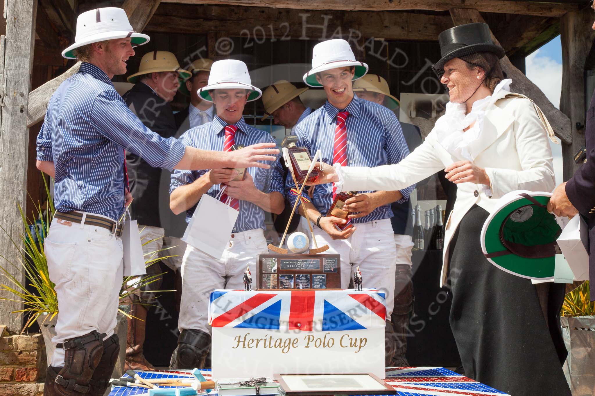 7th Heritage Polo Cup finals: Founder of HERITAGE POLO Barbara P Zingg presenting Silver Fox USA Polo Team with a bottle of 'Amaretto di Saronno'..
Hurtwood Park Polo Club,
Ewhurst Green,
Surrey,
United Kingdom,
on 05 August 2012 at 14:44, image #100