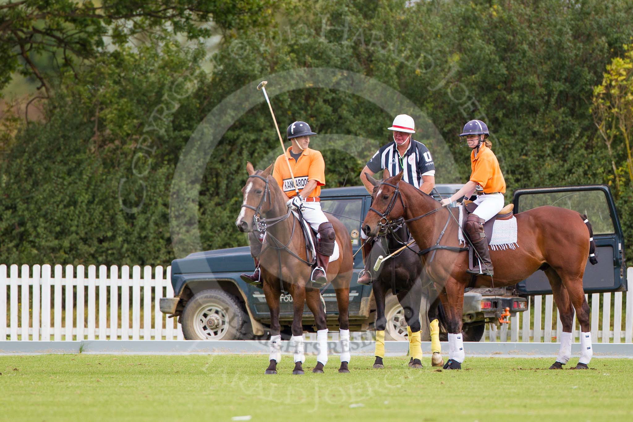 DBPC Polo in the Park 2012: The umpire and club polo manager Ian 'Ginger' Hunt with Huv Bevan and Amy Harper of the Kangaroos team..
Dallas Burston Polo Club,
Stoneythorpe Estate,
Southam,
Warwickshire,
United Kingdom,
on 16 September 2012 at 10:11, image #30
