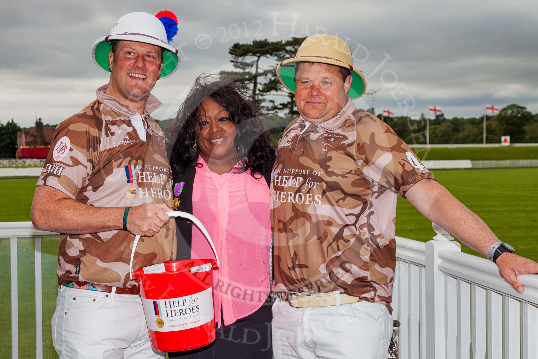 DBPC Polo in the Park 2012: The Royal Artillery Exhibition Game in support of "Help for Heroes" - Major Andy Wood and Bombardier Richard Morris with soul diva Kym Mazelle..
Dallas Burston Polo Club,
Stoneythorpe Estate,
Southam,
Warwickshire,
United Kingdom,
on 16 September 2012 at 15:39, image #238