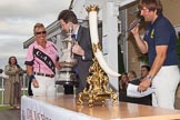 DBPC Polo in the Park 2012: Southam and Kenilworth MP Jeremy Clark at the price-giving, with the winner of the 4 Goal Tusk Trophy Tournament, C.A.N.I., here Lousie Jebson. On the microphon Karl-Ude Martinez..
Dallas Burston Polo Club,
Stoneythorpe Estate,
Southam,
Warwickshire,
United Kingdom,
on 16 September 2012 at 16:40, image #249