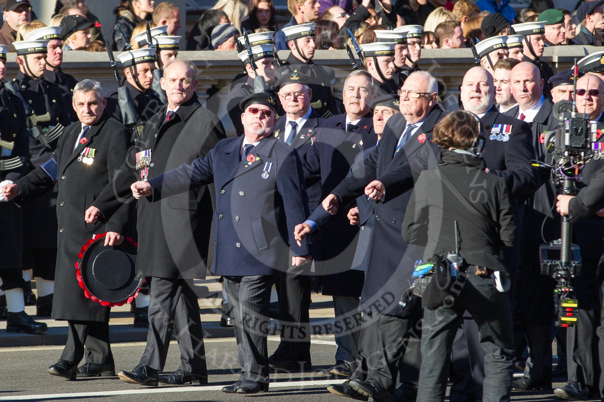 Remembrance Sunday 2012 Cenotaph March Past: Group E8 - The Fleet Air Arm Armourers Association, formed at the outbreak of WW2 to give firepower and air cover to the Atlantic convoys..
Whitehall, Cenotaph,
London SW1,

United Kingdom,
on 11 November 2012 at 11:39, image #91