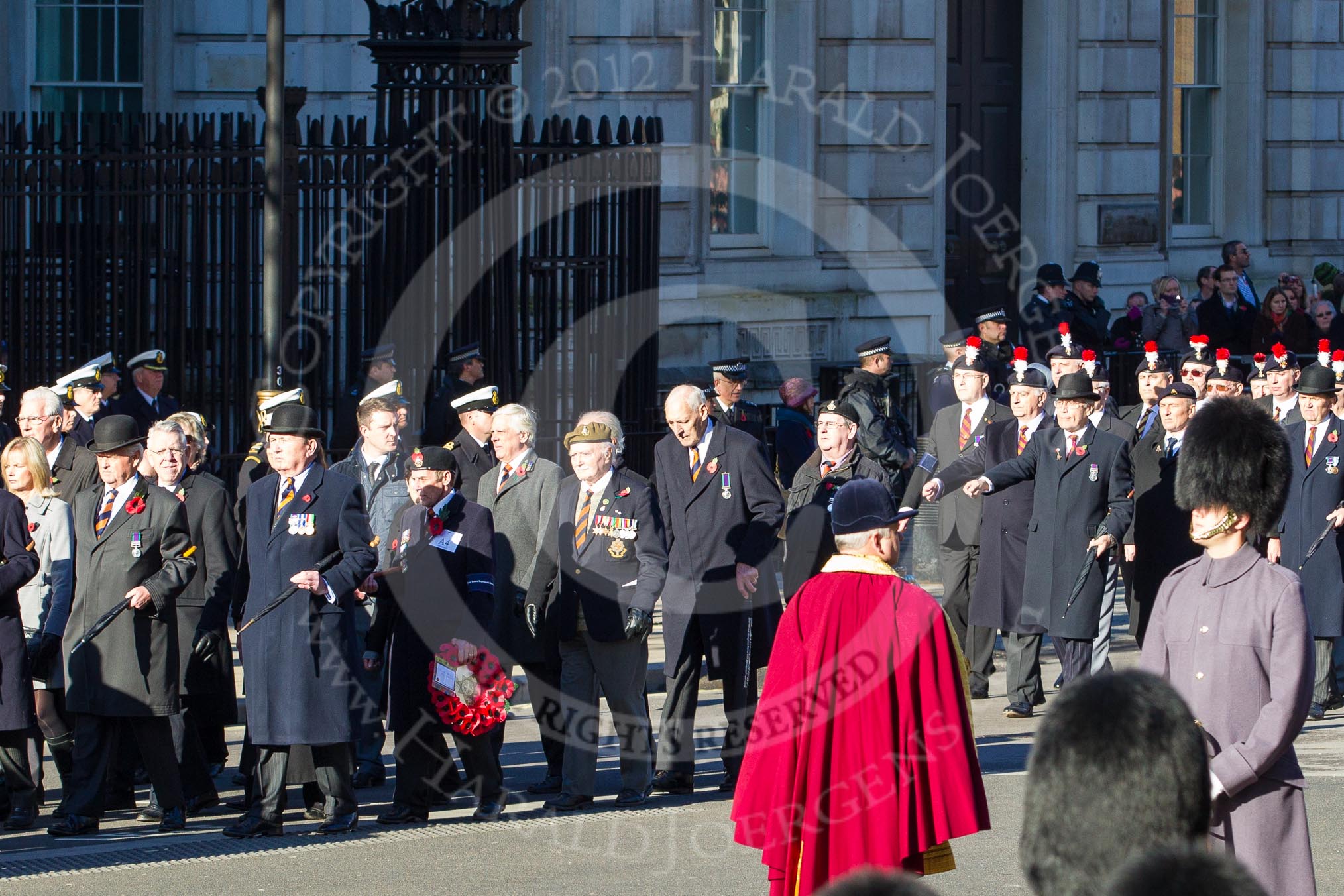 Remembrance Sunday 2012 Cenotaph March Past: Group A4 - Royal Sussex Regimental Association and A5 - Royal Hampshire Regiment Comrades Association..
Whitehall, Cenotaph,
London SW1,

United Kingdom,
on 11 November 2012 at 11:48, image #569
