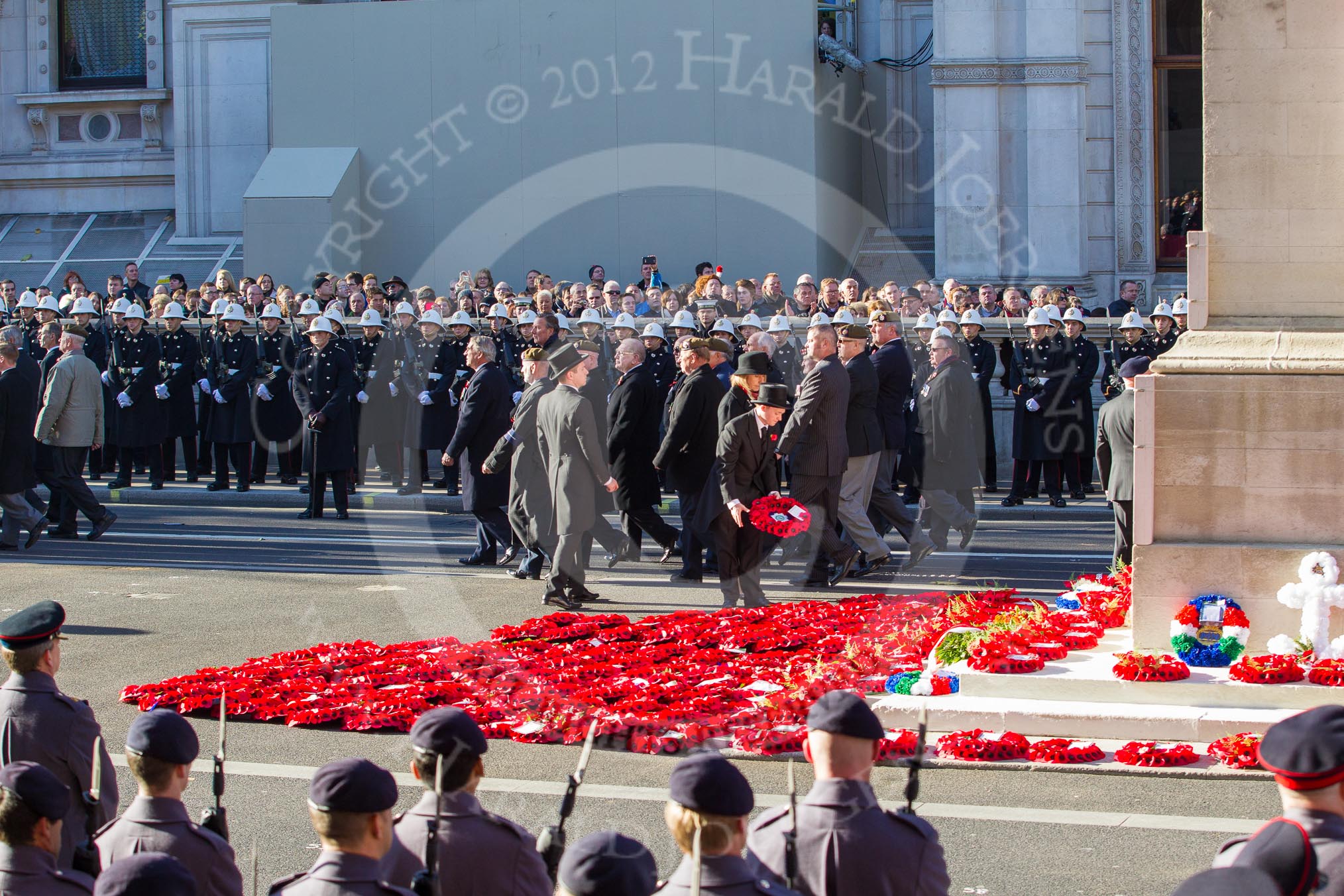 Remembrance Sunday 2012 Cenotaph March Past: Wreaths are placed at the western side of the Cenotaph during the March Past, creating a field of red poppies..
Whitehall, Cenotaph,
London SW1,

United Kingdom,
on 11 November 2012 at 11:53, image #765