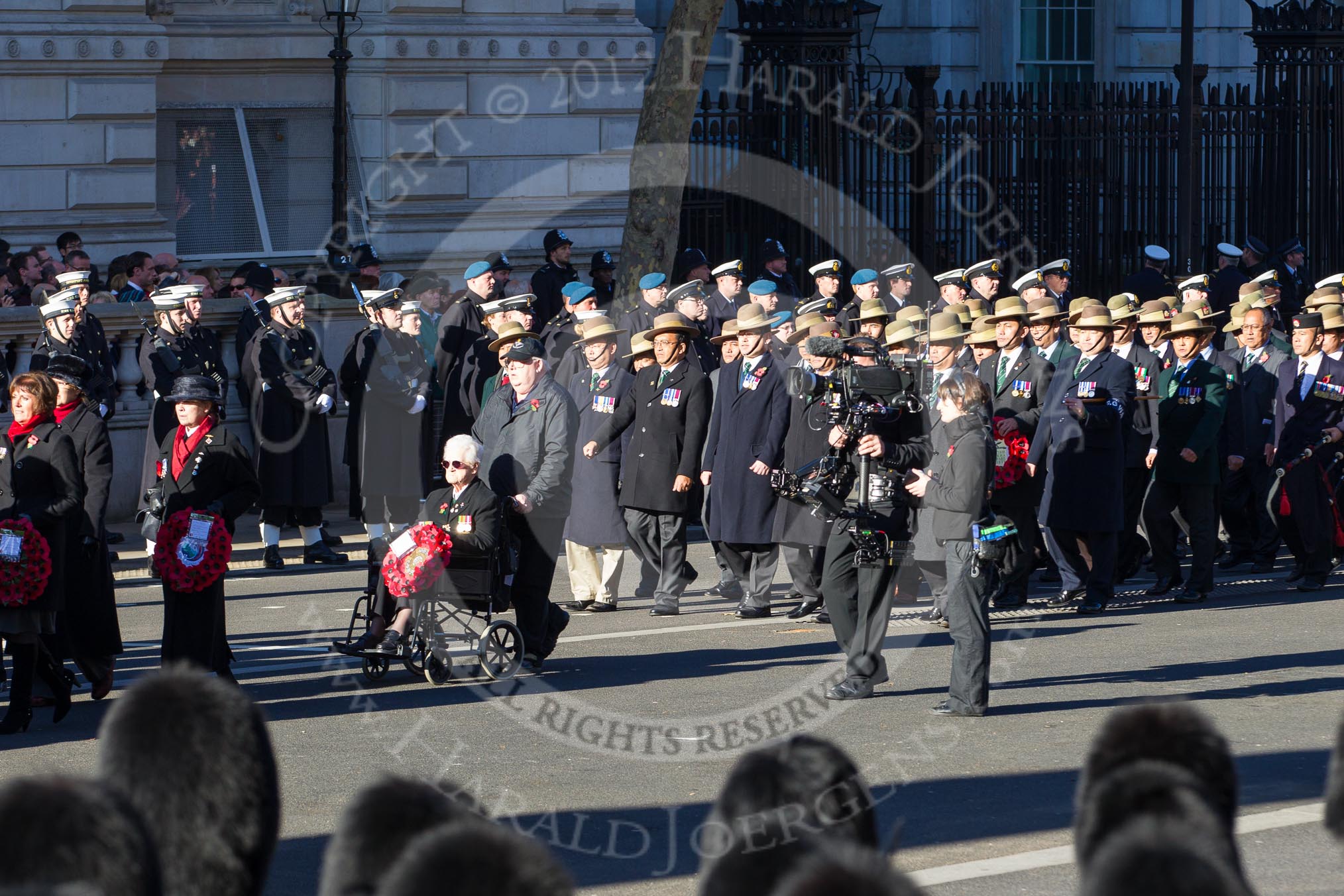 Remembrance Sunday 2012 Cenotaph March Past: Group D6 - War Widows Association and D7 - British Gurkha Welfare Society..
Whitehall, Cenotaph,
London SW1,

United Kingdom,
on 11 November 2012 at 12:06, image #1275