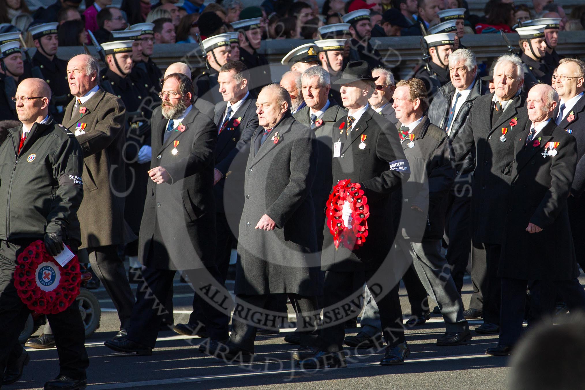 Remembrance Sunday 2012 Cenotaph March Past: Group M17 - St Andrew's Ambulance Association, and M18 - Firefighters Memorial Charitable Trust..
Whitehall, Cenotaph,
London SW1,

United Kingdom,
on 11 November 2012 at 12:11, image #1541