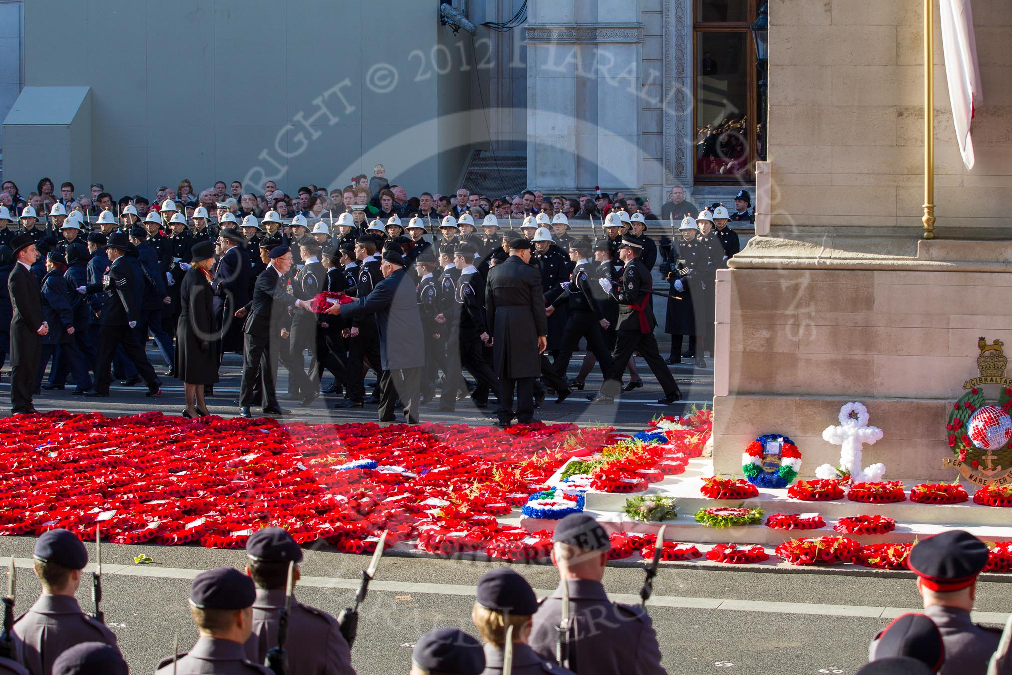 Remembrance Sunday 2012 Cenotaph March Past: The western side of the Cenotaph after the March Past, with the bright red of the hundreds wreaths laid during the March Past..
Whitehall, Cenotaph,
London SW1,

United Kingdom,
on 11 November 2012 at 12:16, image #1772