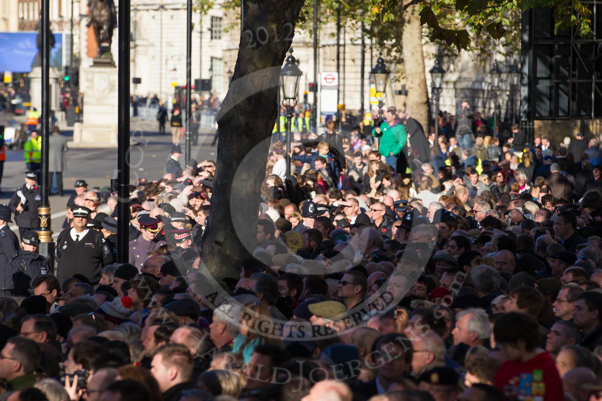 Remembrance Sunday 2012 Cenotaph March Past: Crowd on the southern sode of Whitehall, waiting for the barriers to be removed, after the Cenotaph Ceremony and the March Past..
Whitehall, Cenotaph,
London SW1,

United Kingdom,
on 11 November 2012 at 12:25, image #1793