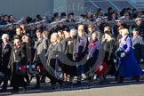 Remembrance Sunday 2012 Cenotaph March Past: Group M23 - Civilians Representing Families..
Whitehall, Cenotaph,
London SW1,

United Kingdom,
on 11 November 2012 at 12:12, image #1588