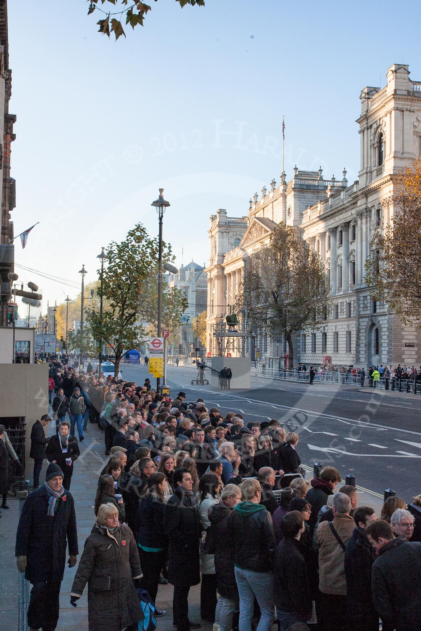 Whitehall, looking to the west, in the morning of Remembrance Sunday. Despite the early hour, and the security checks on both sides of Whitehall, a large crowd is building up.