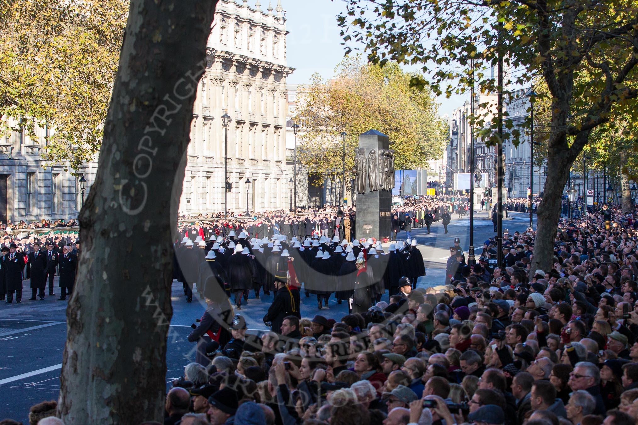 The Band of the Royal Marines gets into position on the eastern side of the Cenotaph, in front of the Memorial for Women in World War II.