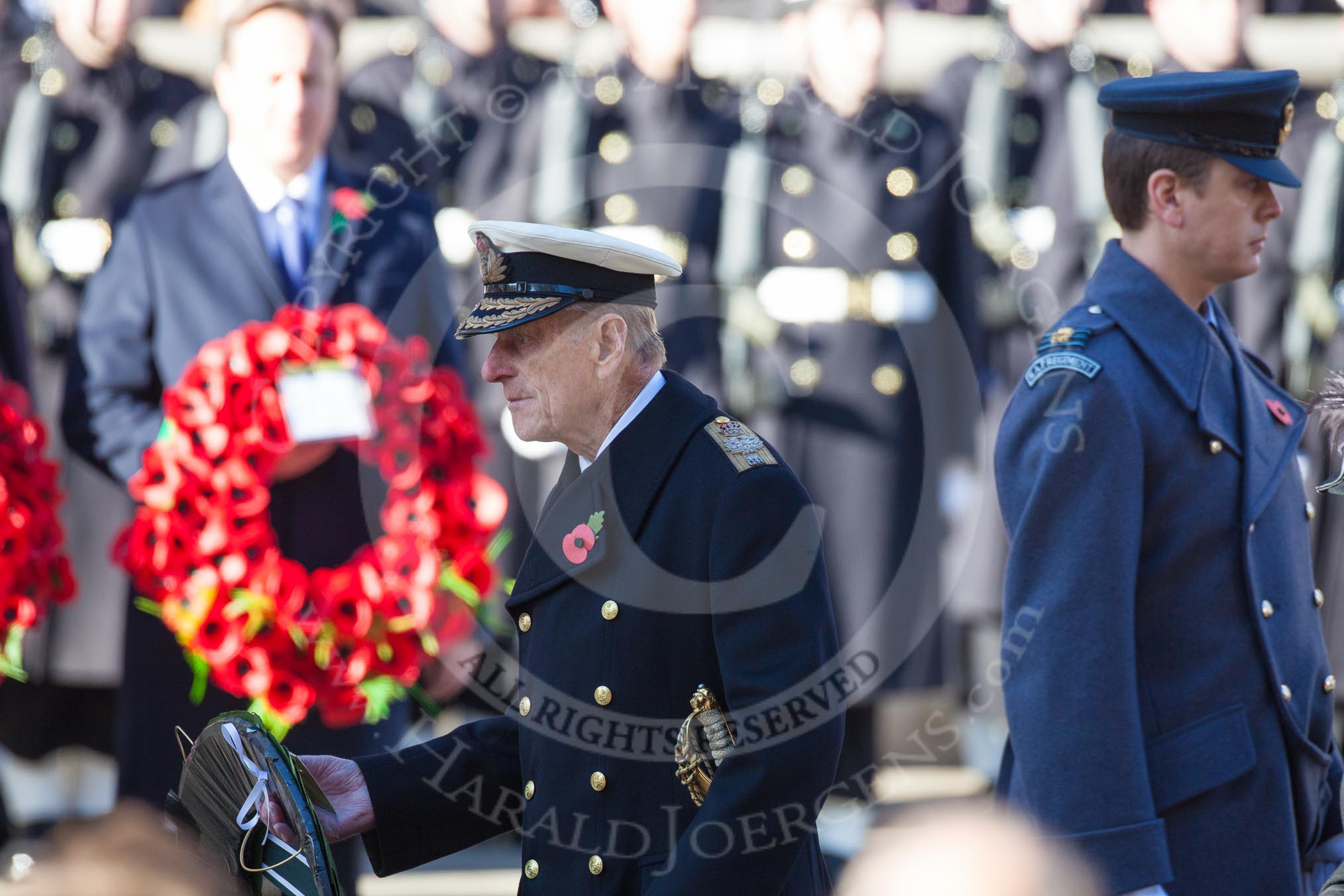 HRH The Duke of Edinburgh, about to lay the wreath that has just been given to him by the Equerry, Squadron Leader Dale White, RAF, on the right.