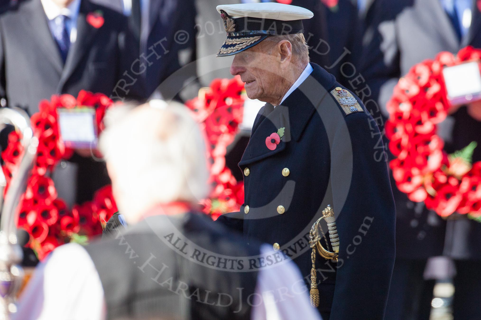 HRH The Duke of Edinburgh, about to lay his wreath at the Cenotaph. In the foreground and unsharp the Bishop of London.