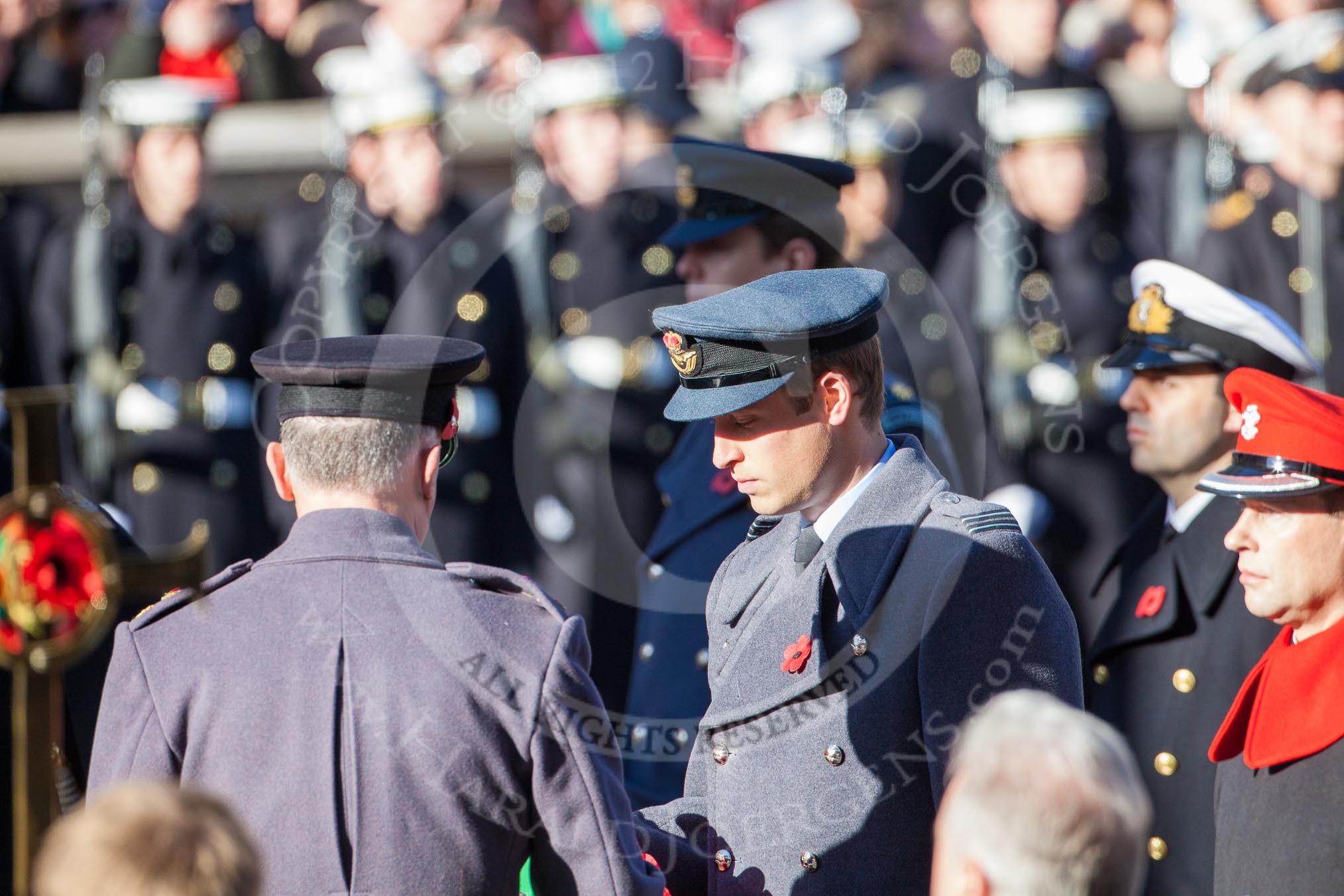 HRH The Duke of Cambridge is given the wreath by Major James Lowther-Pinkerton.