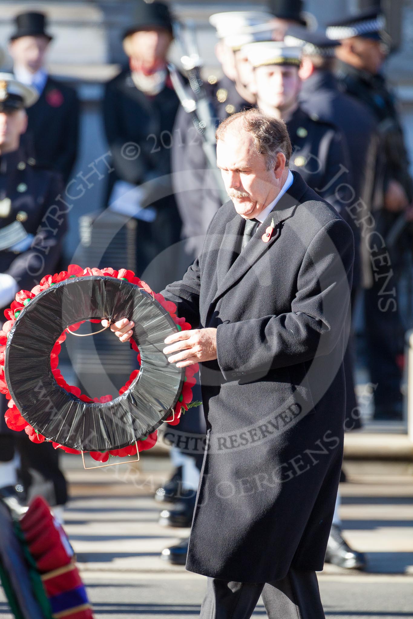Elfyn Llywd as Westminster Plaid Cymru Group Leader, about to lay a wreath at the Cenotaph.