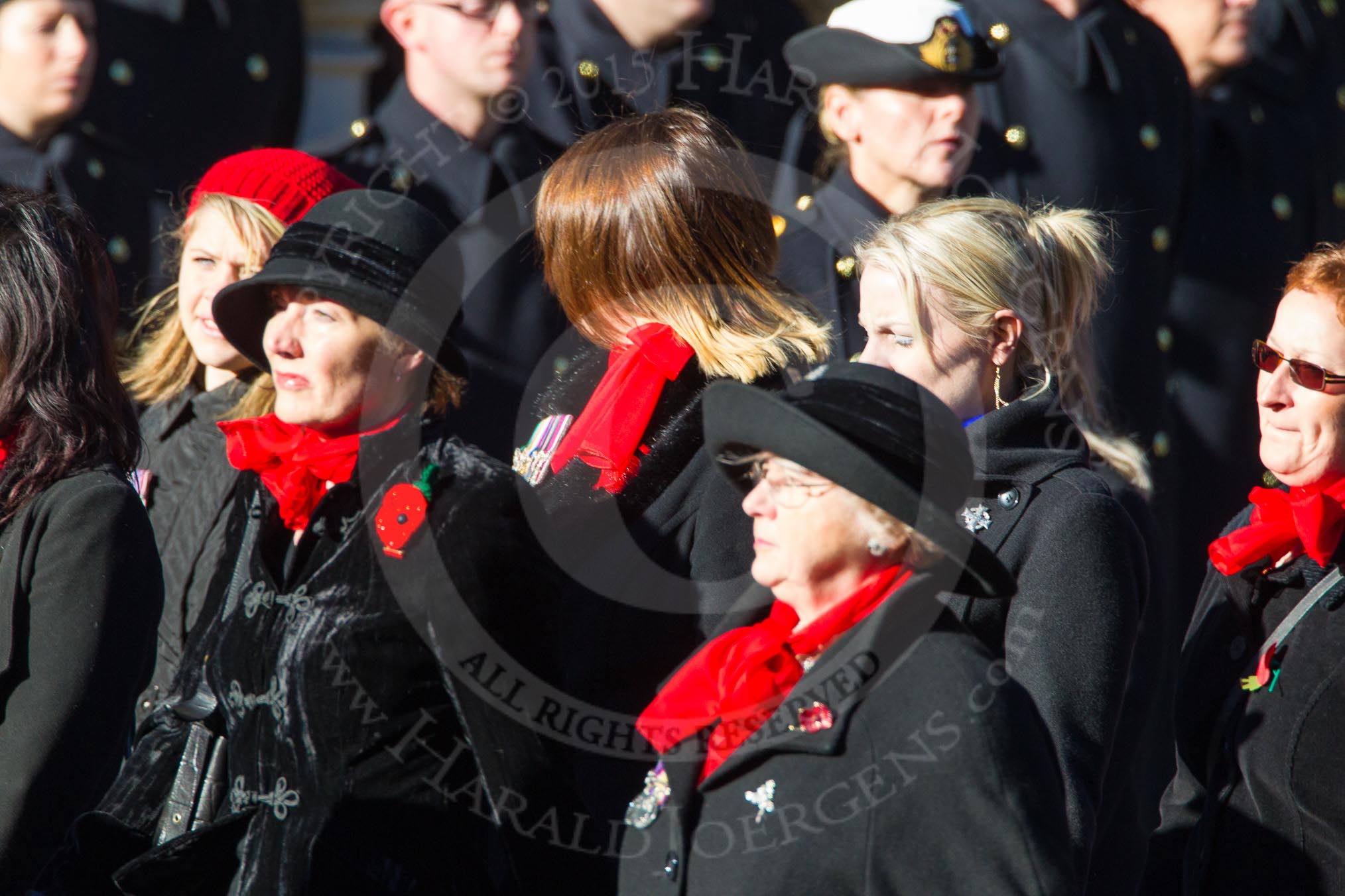 Remembrance Sunday Cenotaph March Past 2013: D1 - War Widows Association. The War Widows' Association exisits to improve the conditions of all War Widow/ers in the United Kingdom. The Association formed in 1971 following an article in a Sunday newspaper that highlighted the plight of Britain’s “forgotten women”. The Association gained charitable status in 1991 and continues to campaign against injustice..
Press stand opposite the Foreign Office building, Whitehall, London SW1,
London,
Greater London,
United Kingdom,
on 10 November 2013 at 11:38, image #23