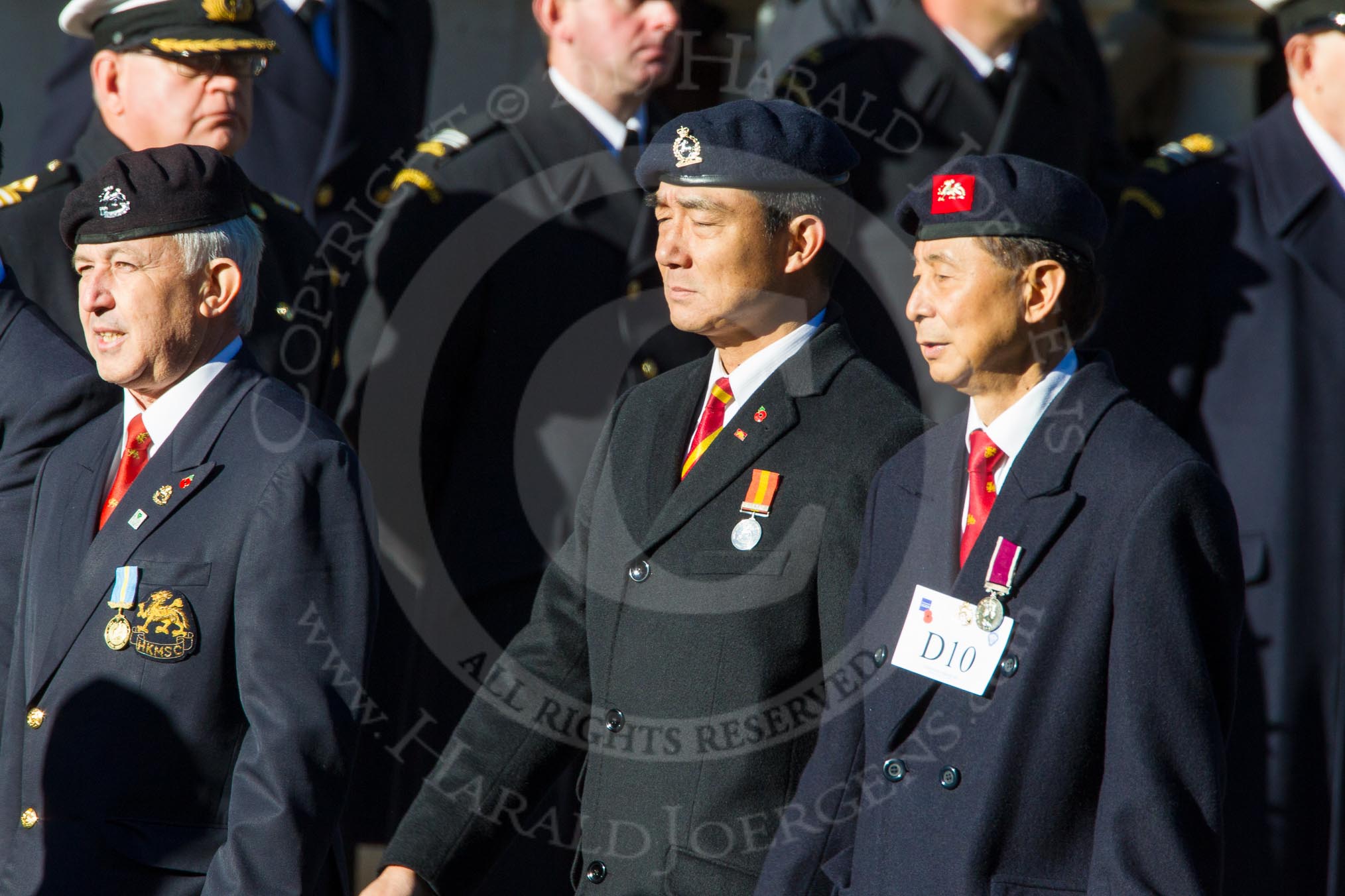 Remembrance Sunday Cenotaph March Past 2013: D10 - Hong Kong Military Service Corps..
Press stand opposite the Foreign Office building, Whitehall, London SW1,
London,
Greater London,
United Kingdom,
on 10 November 2013 at 11:39, image #85