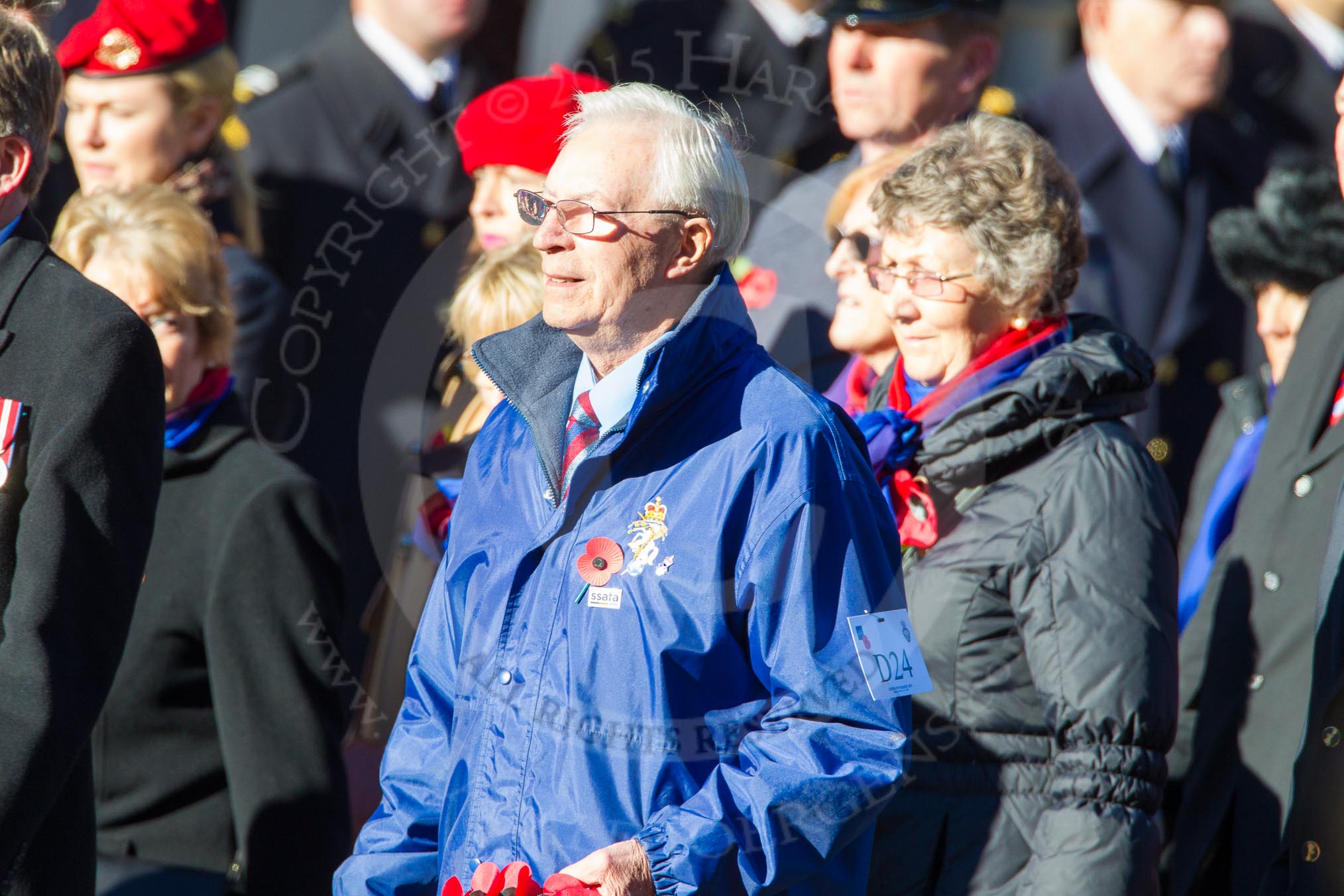 Remembrance Sunday Cenotaph March Past 2013: D24 - SSAFA Forces Help, set up to help former and serving members of the British Armed Forces and their families or dependants. The Wreath Bearer, in the blue coat, is Mr Chris Flaherty.  He served in the British Army from 1958 to 1971 in the corps of the Royal Electrical Mechanical Engineers.  He has been a SSAFA Caseworker in the Hertfordshire Branch for 4 years..
Press stand opposite the Foreign Office building, Whitehall, London SW1,
London,
Greater London,
United Kingdom,
on 10 November 2013 at 11:41, image #194