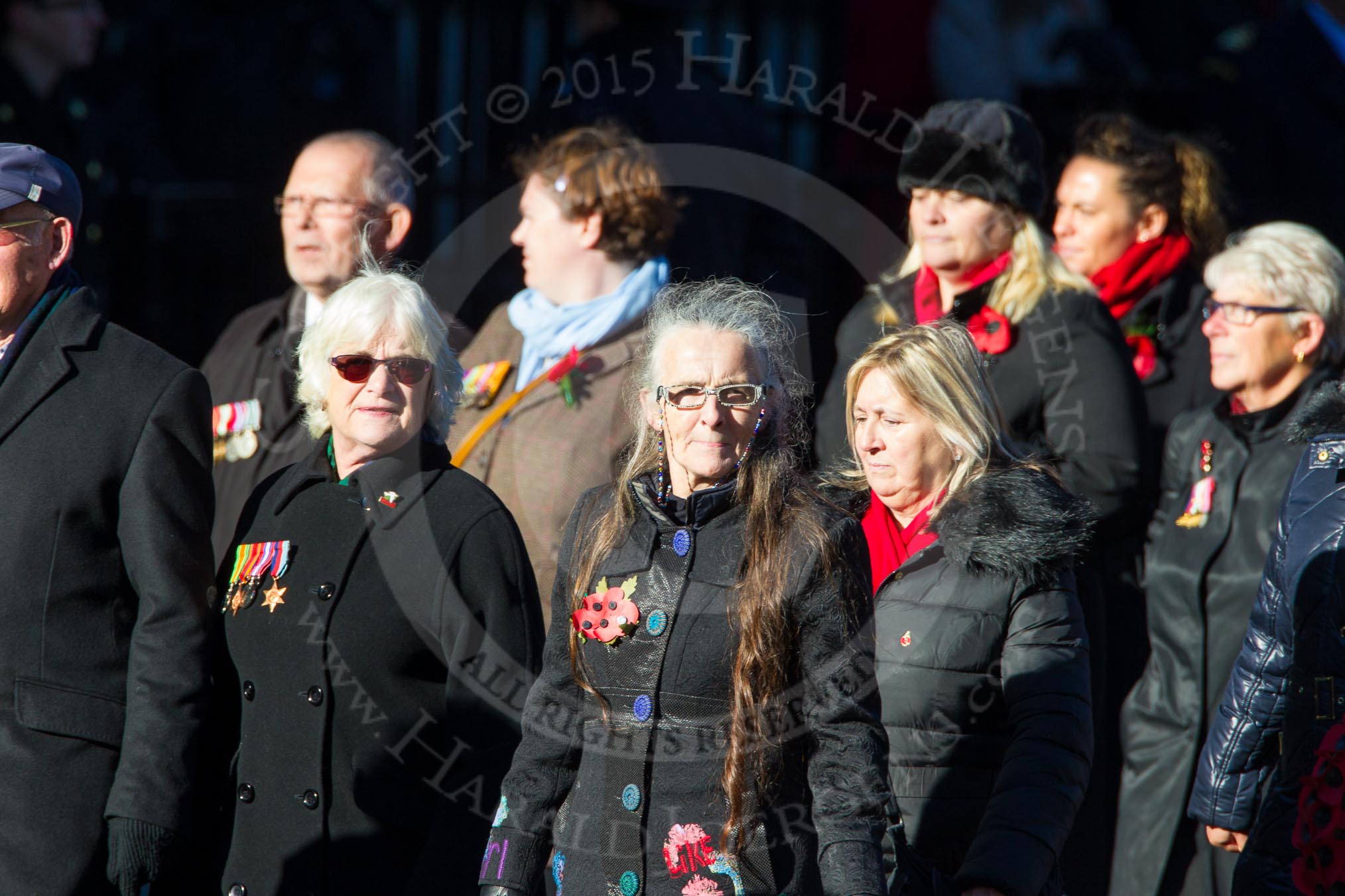 Remembrance Sunday Cenotaph March Past 2013: M23 - Civilians Representing Families..
Press stand opposite the Foreign Office building, Whitehall, London SW1,
London,
Greater London,
United Kingdom,
on 10 November 2013 at 12:12, image #2061