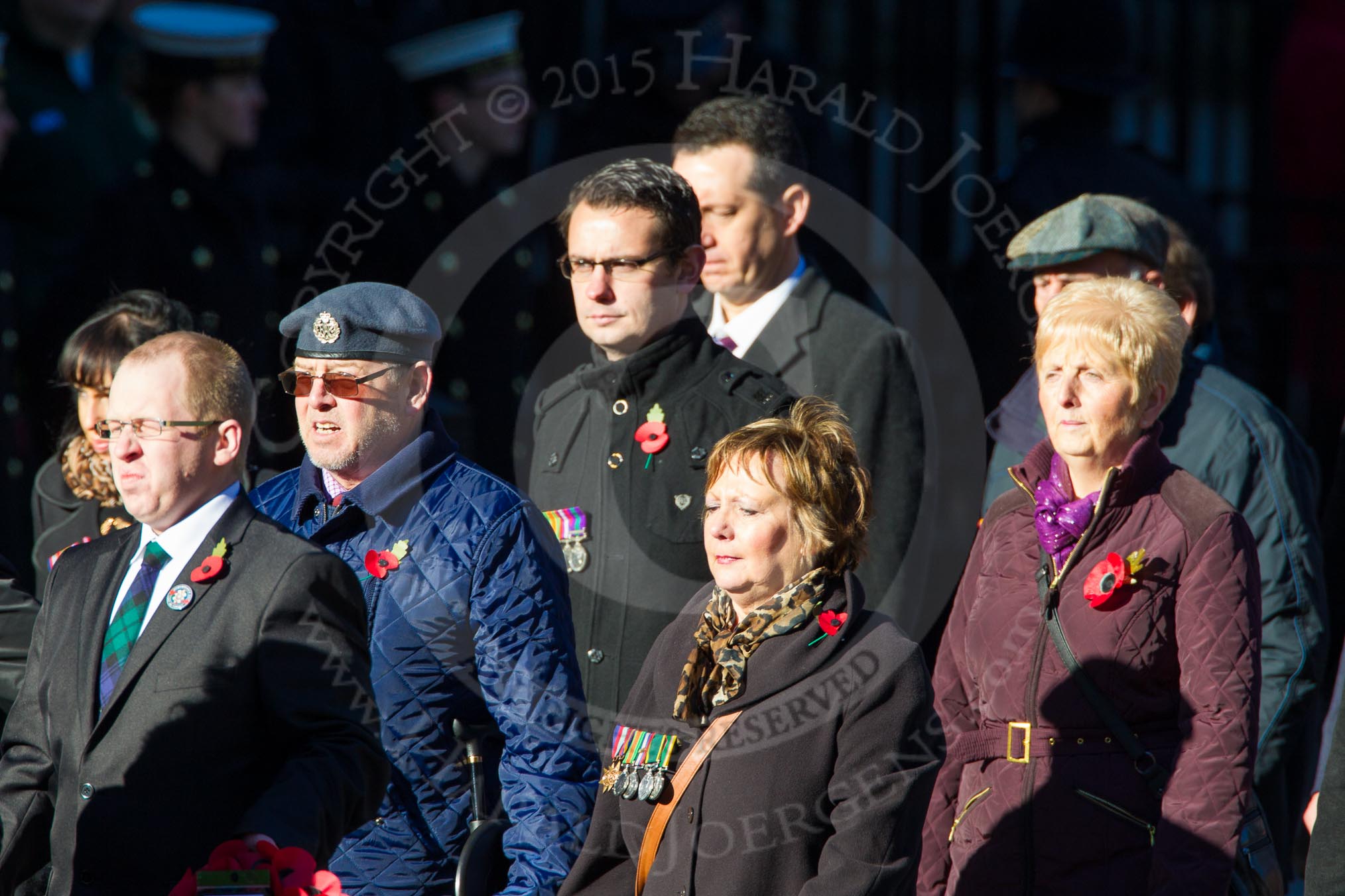 Remembrance Sunday Cenotaph March Past 2013: M23 - Civilians Representing Families..
Press stand opposite the Foreign Office building, Whitehall, London SW1,
London,
Greater London,
United Kingdom,
on 10 November 2013 at 12:12, image #2065