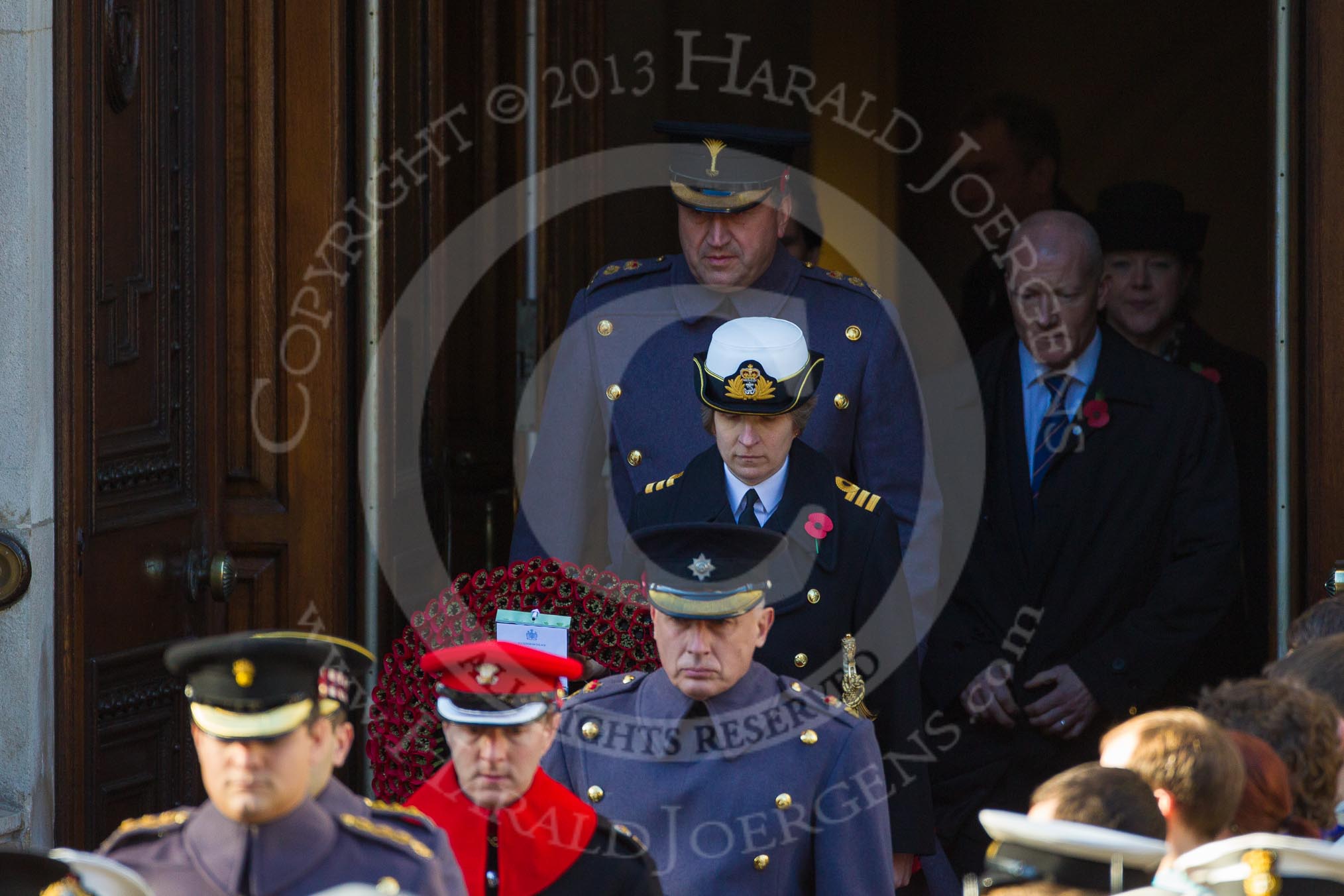 Equerries bearing Royal Wreaths emerging from the Foreign and Commonwealth Building.