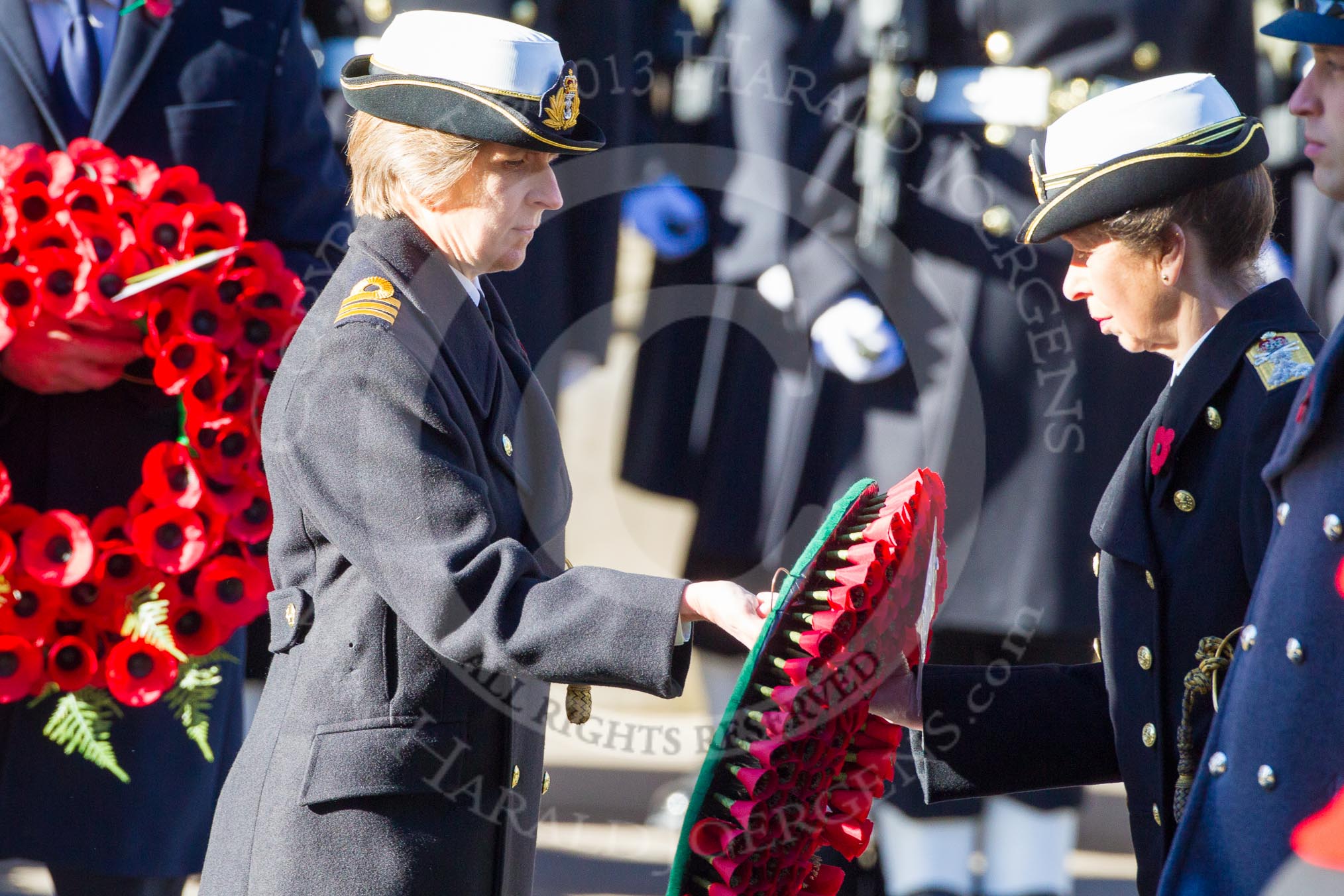 HRH The EPrincess Royal is given the wreath by Commander Anne Sullivan, RN.